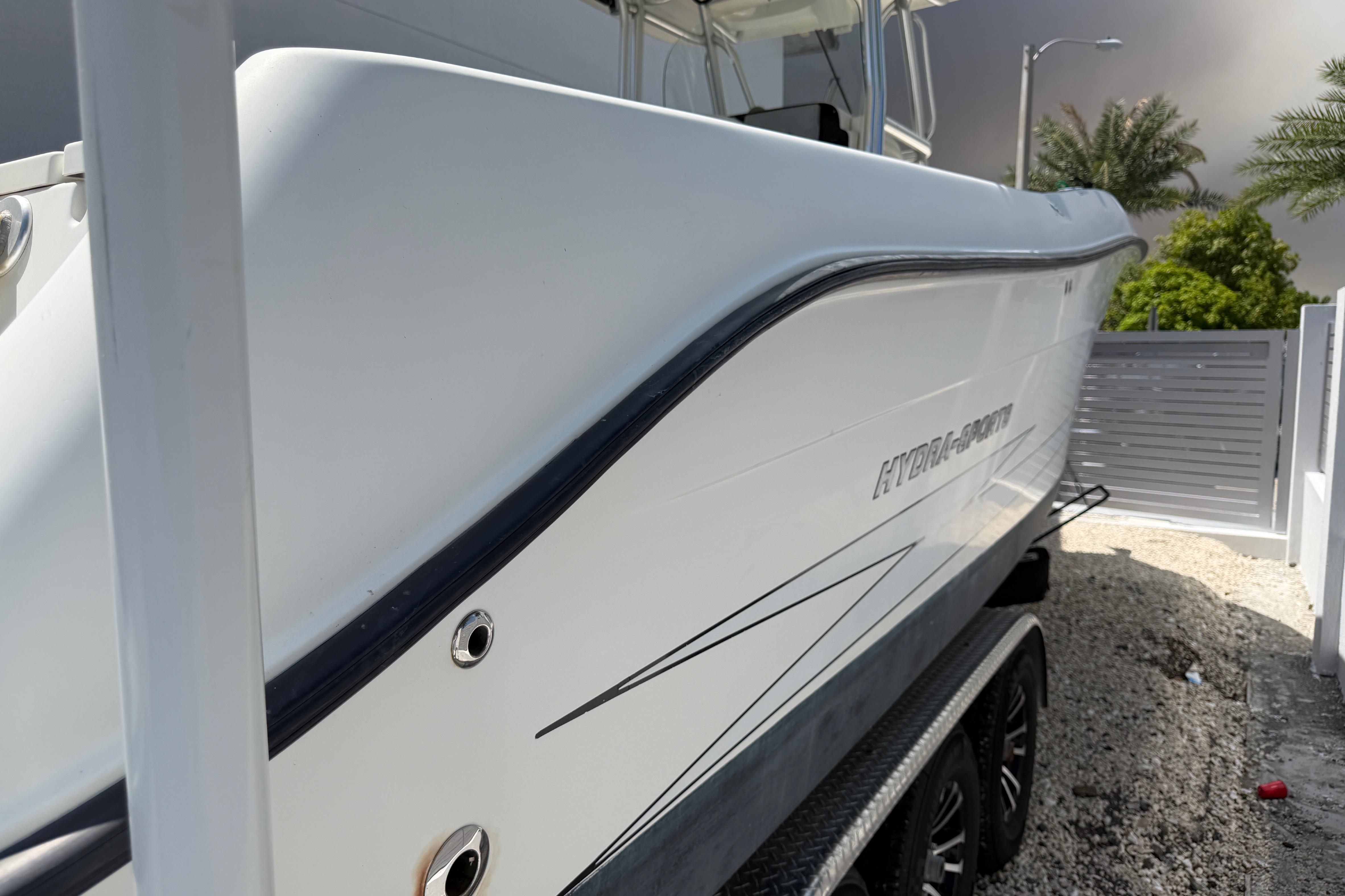 2008 Hydra-Sports Vector 2900 CC boat on trailer, side view with sleek design.