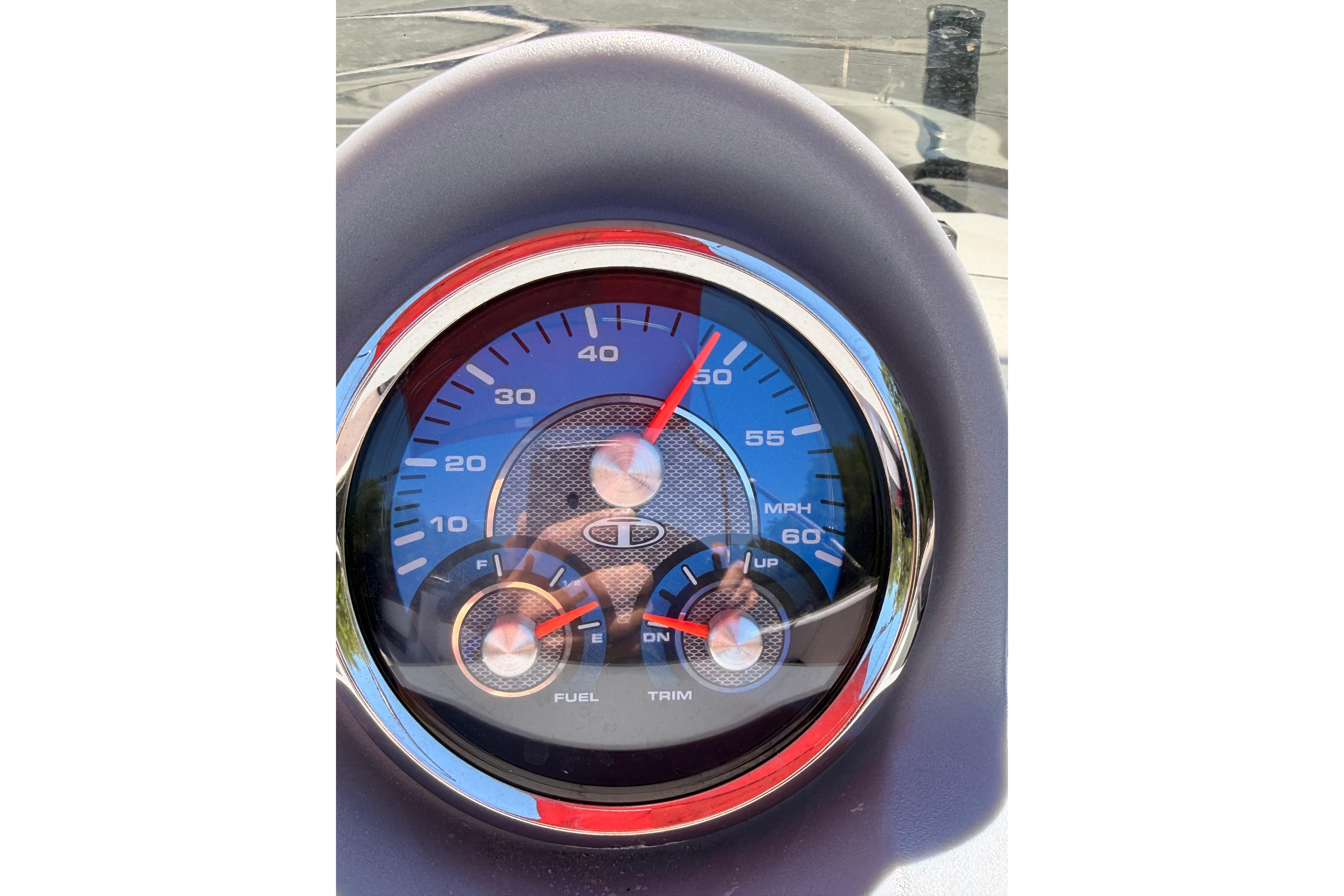 Close-up of 2022 Tahoe T18 speedometer showing speed and fuel gauges.