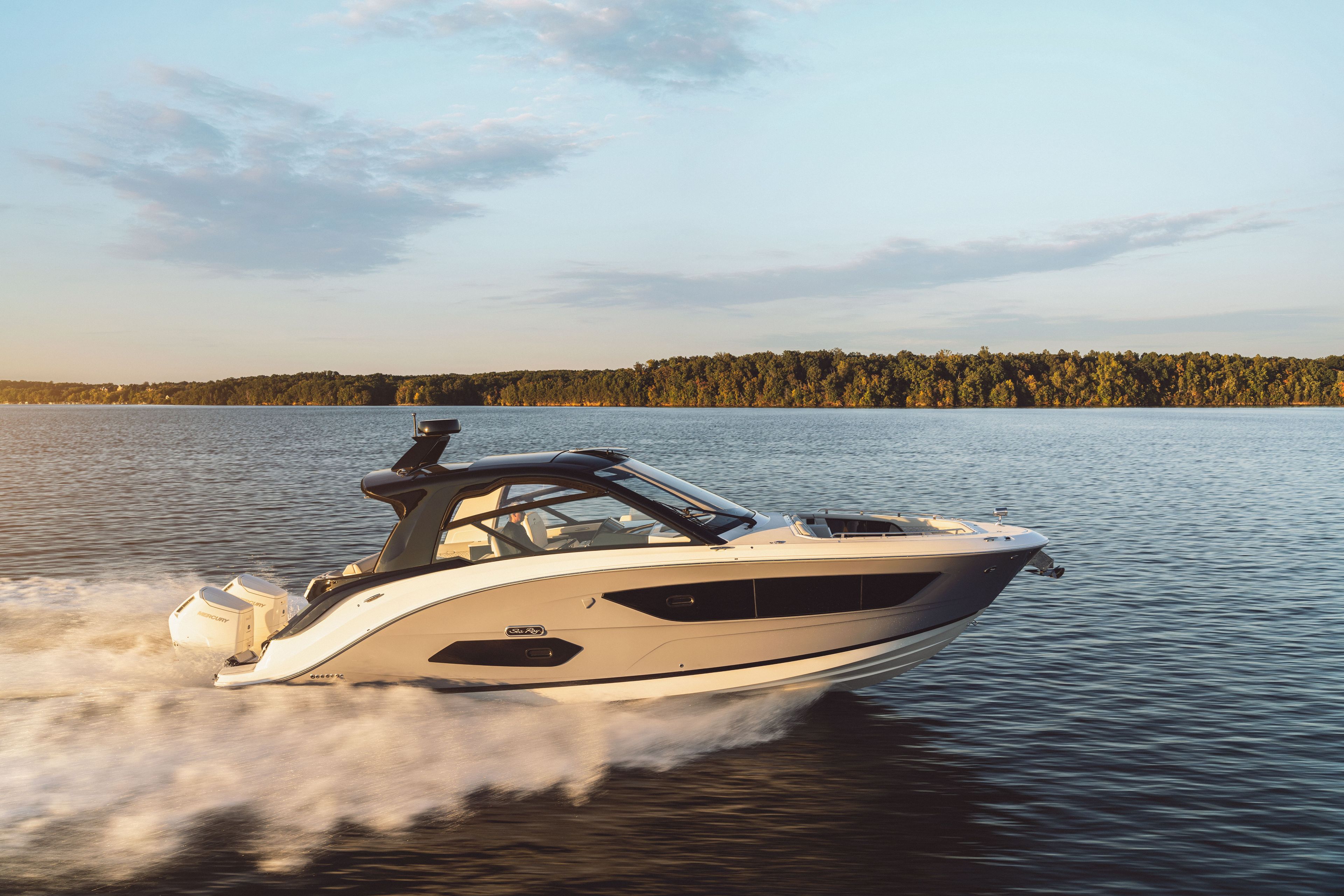 2026 Sea Ray Sundancer 370 Outboard cruising on a calm lake.