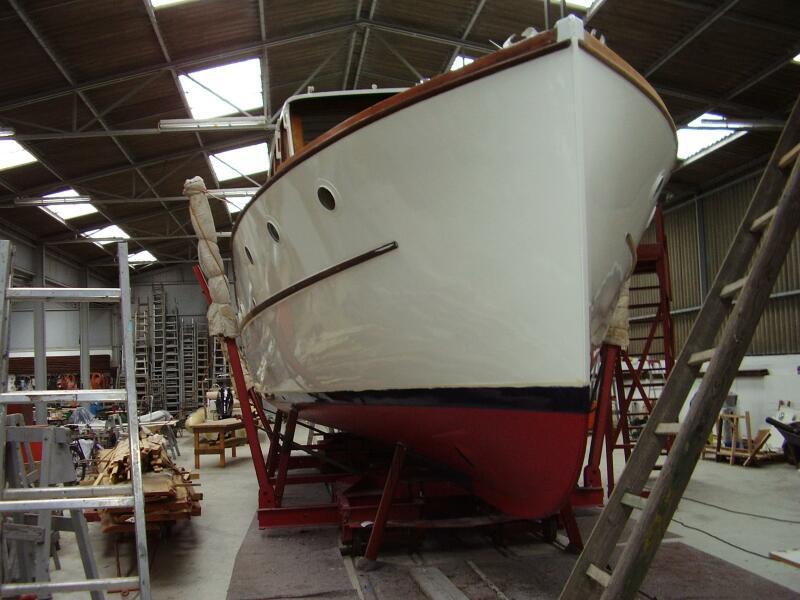 1934 Monk 50 boat in a workshop, undergoing restoration.