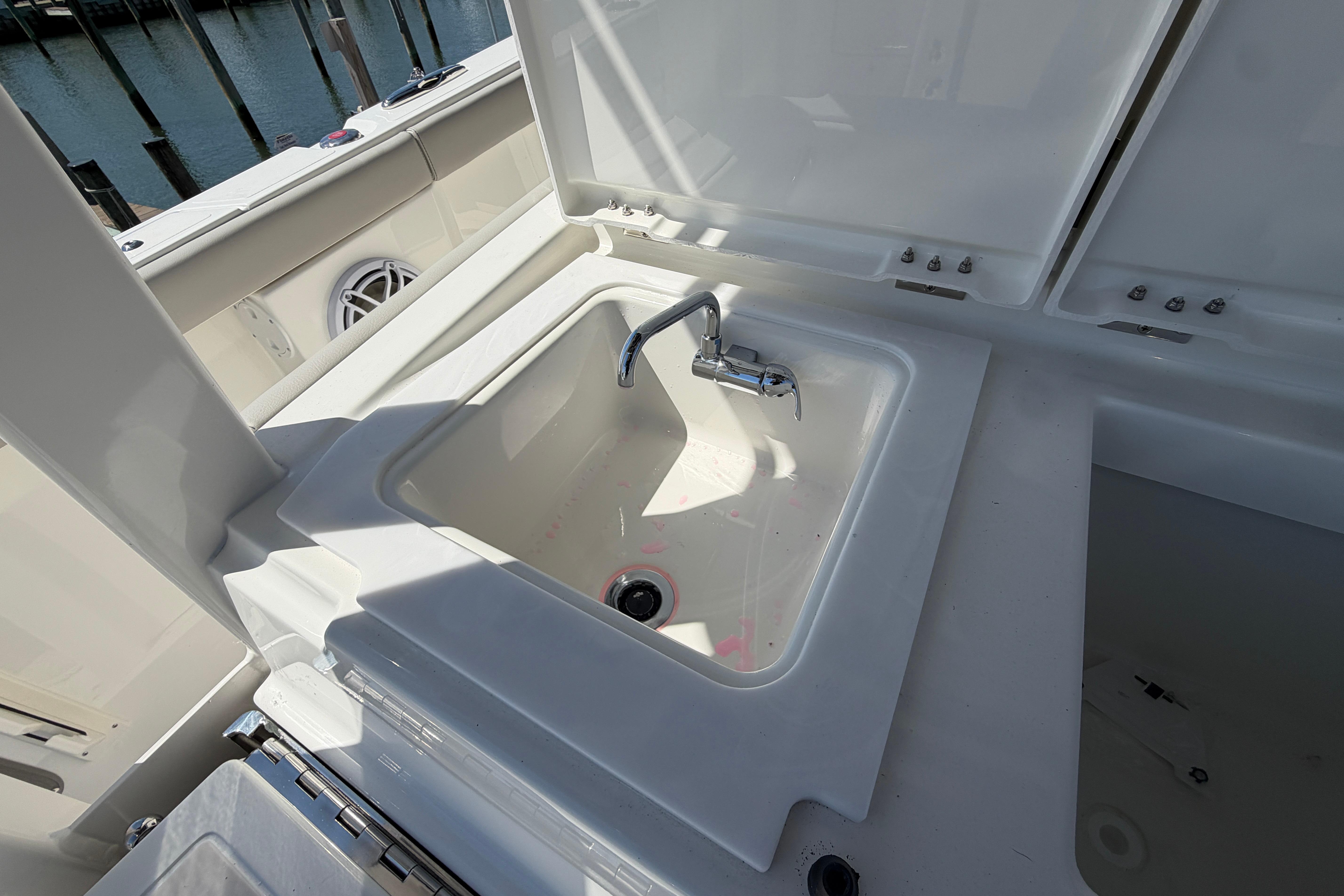 Sink area on 2026 Pursuit S 358 Sport boat, featuring a sleek faucet design.