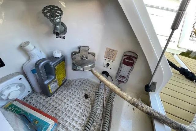 2016 Sea Ray Sundancer 510 yacht utility area with hoses and maintenance supplies.