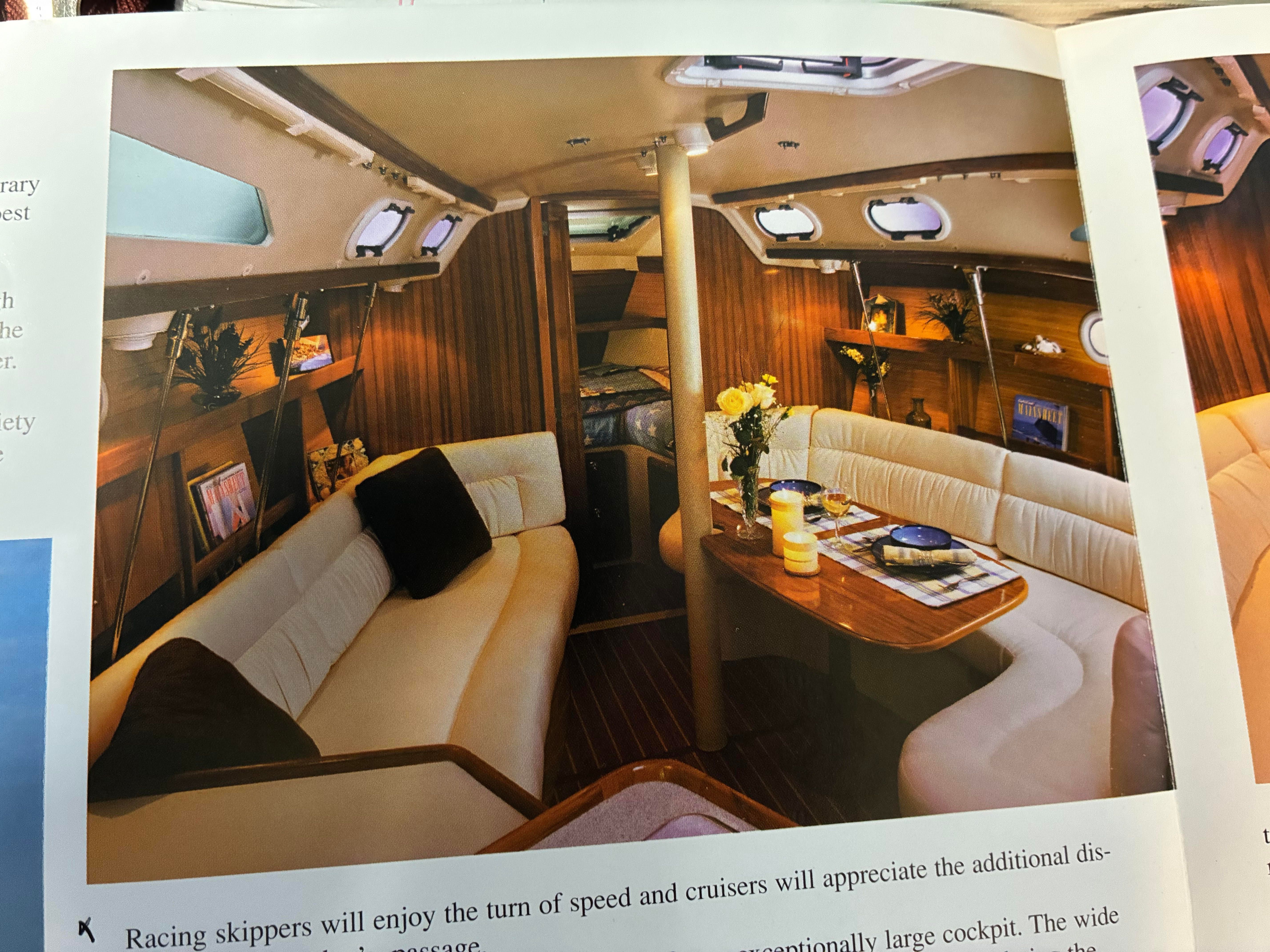 Interior of a 2001 Catalina 320 yacht with cozy seating area.