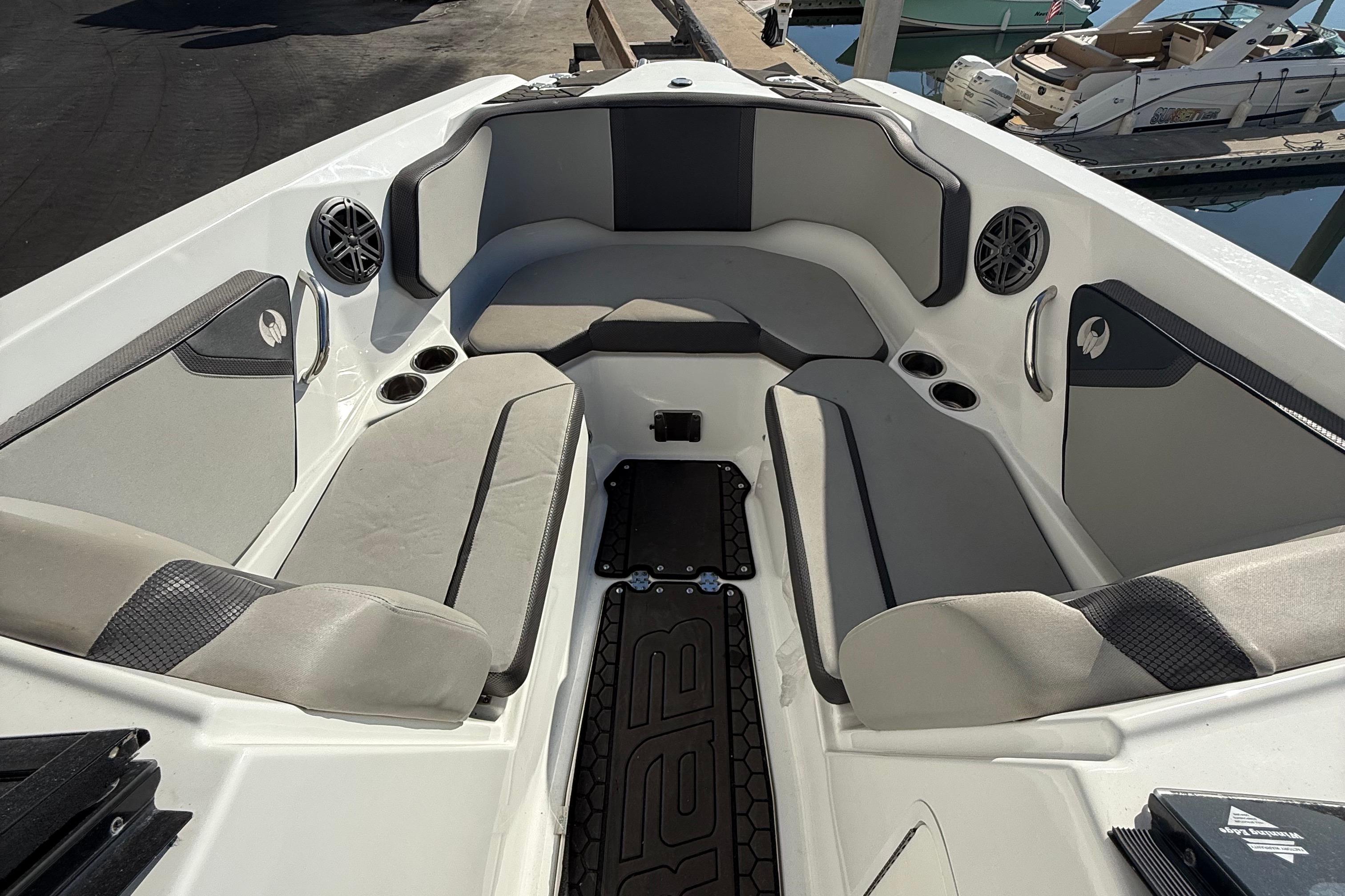 2021 Scarab 255 ID boat interior with gray seating and cup holders.