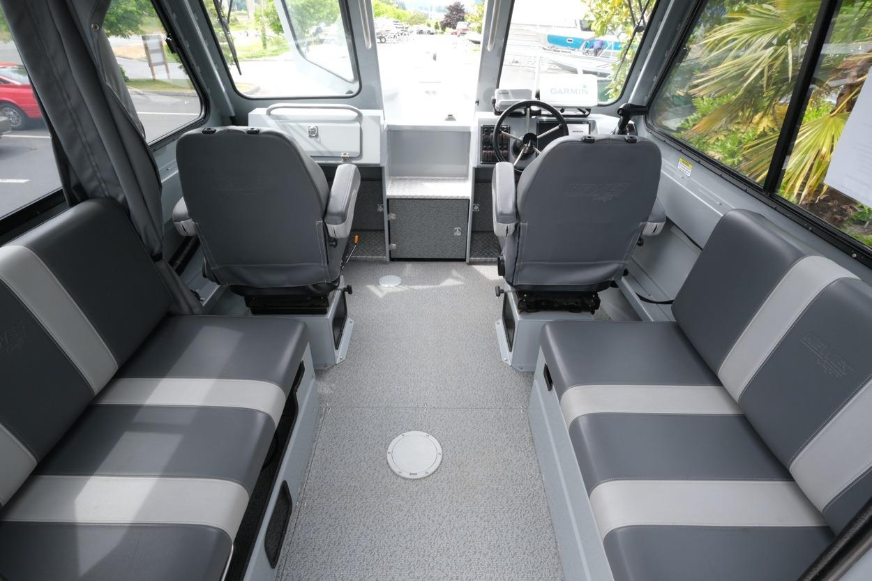Interior of 2021 Hewescraft 240 Ocean Pro ET Hardtop, featuring spacious seating and modern design.