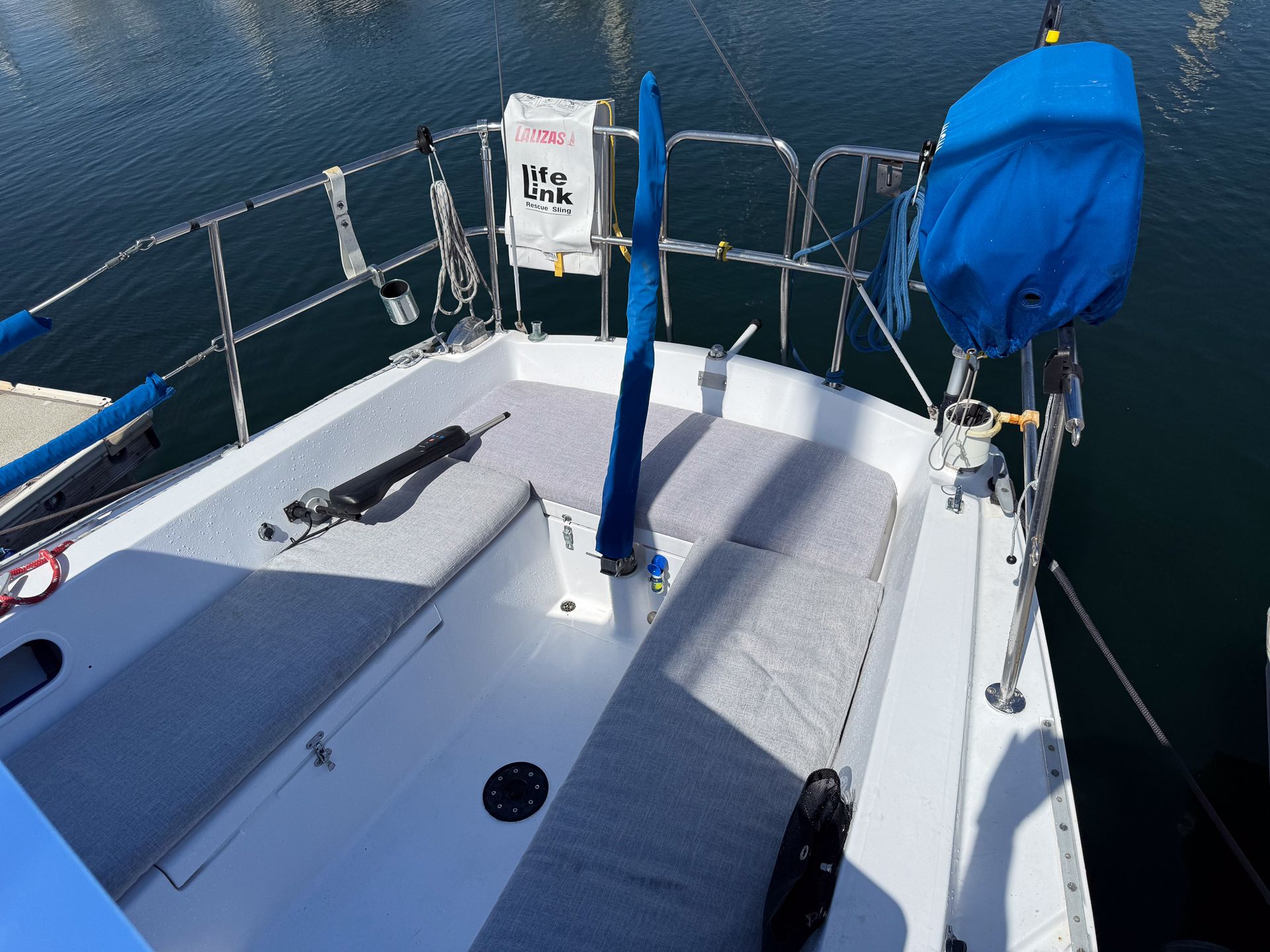 Cockpit of a 1981 Catalina 30 yacht docked in harbor.