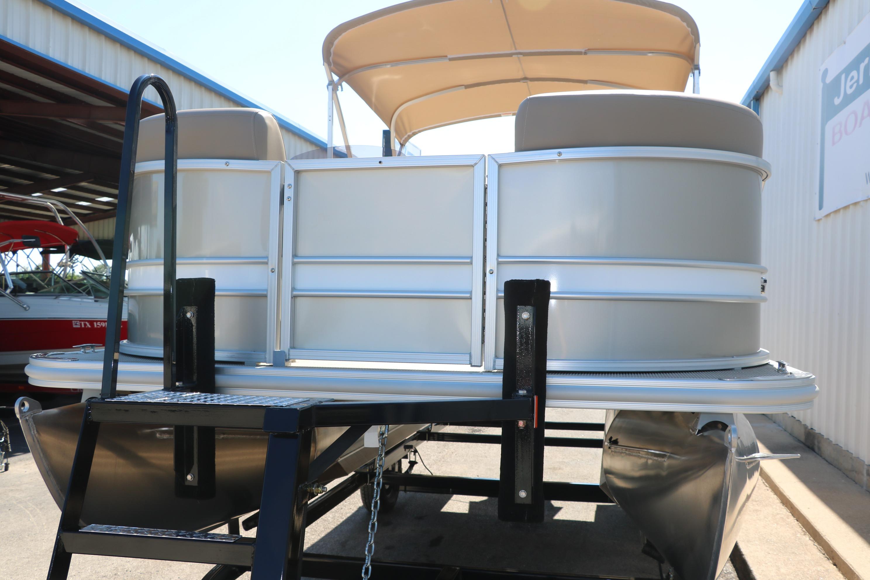 2025 Sylvan Mirage 820 CLZ DH pontoon boat on trailer, under sunny sky.