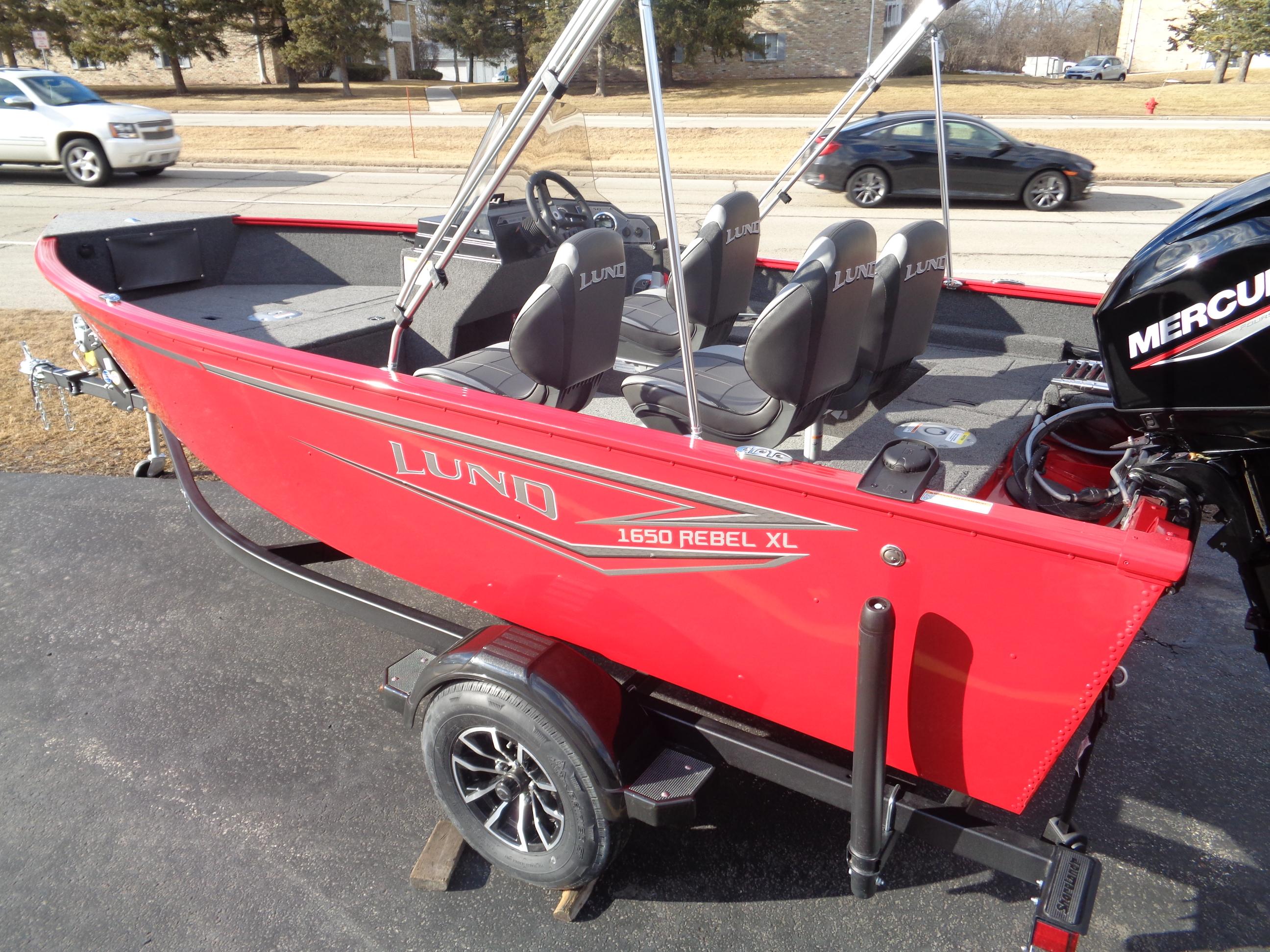 2025 Lund 1650 Rebel XL SS boat, red exterior, on trailer, with Mercury outboard motor.