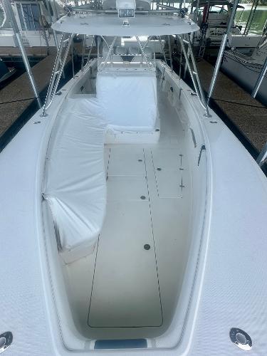 2008 SeaVee 390B boat, spacious deck, white seating, and canopy.