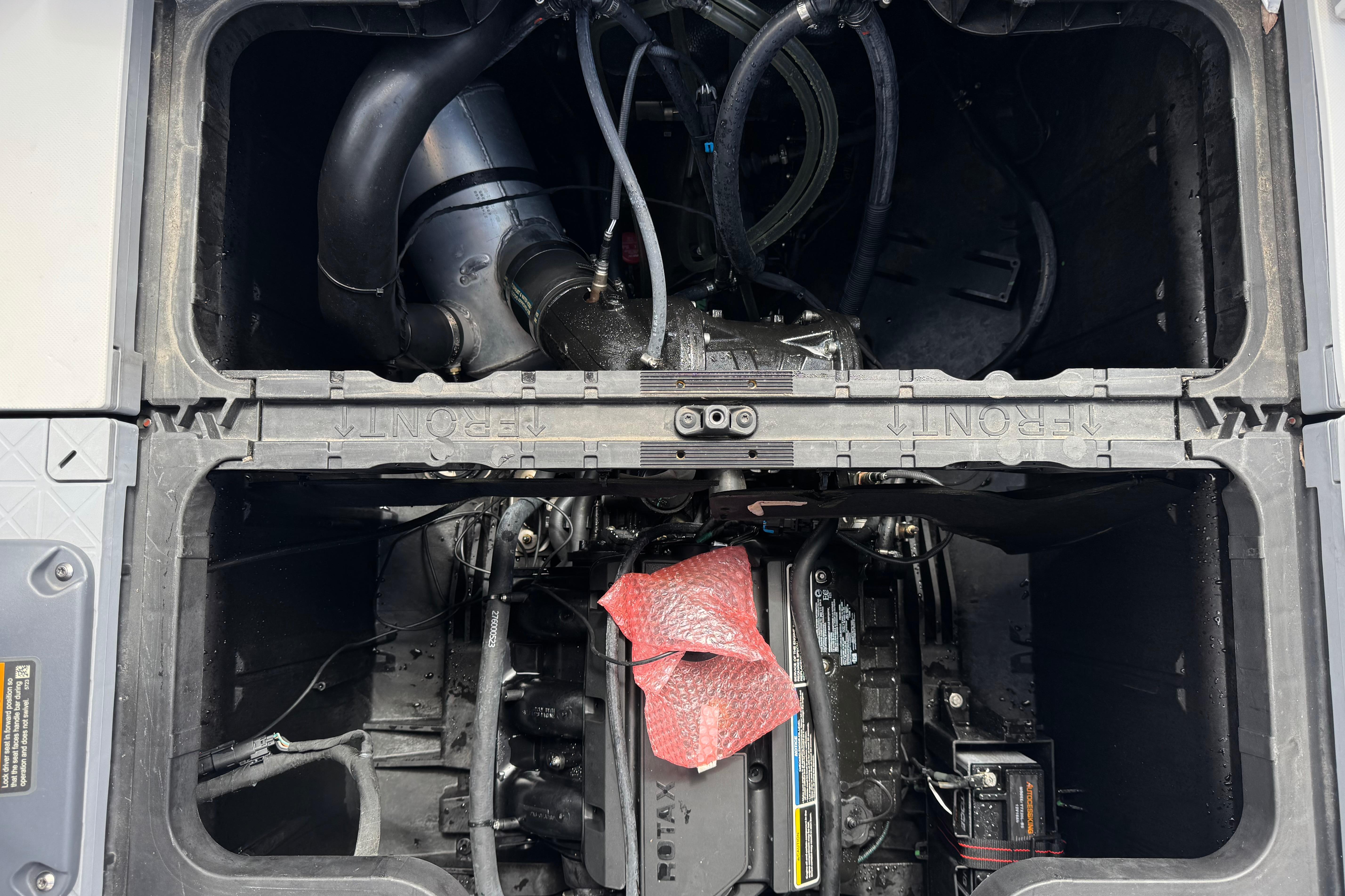 Engine compartment of 2023 Sea-Doo Switch Cruise 18, showcasing internal components and wiring.