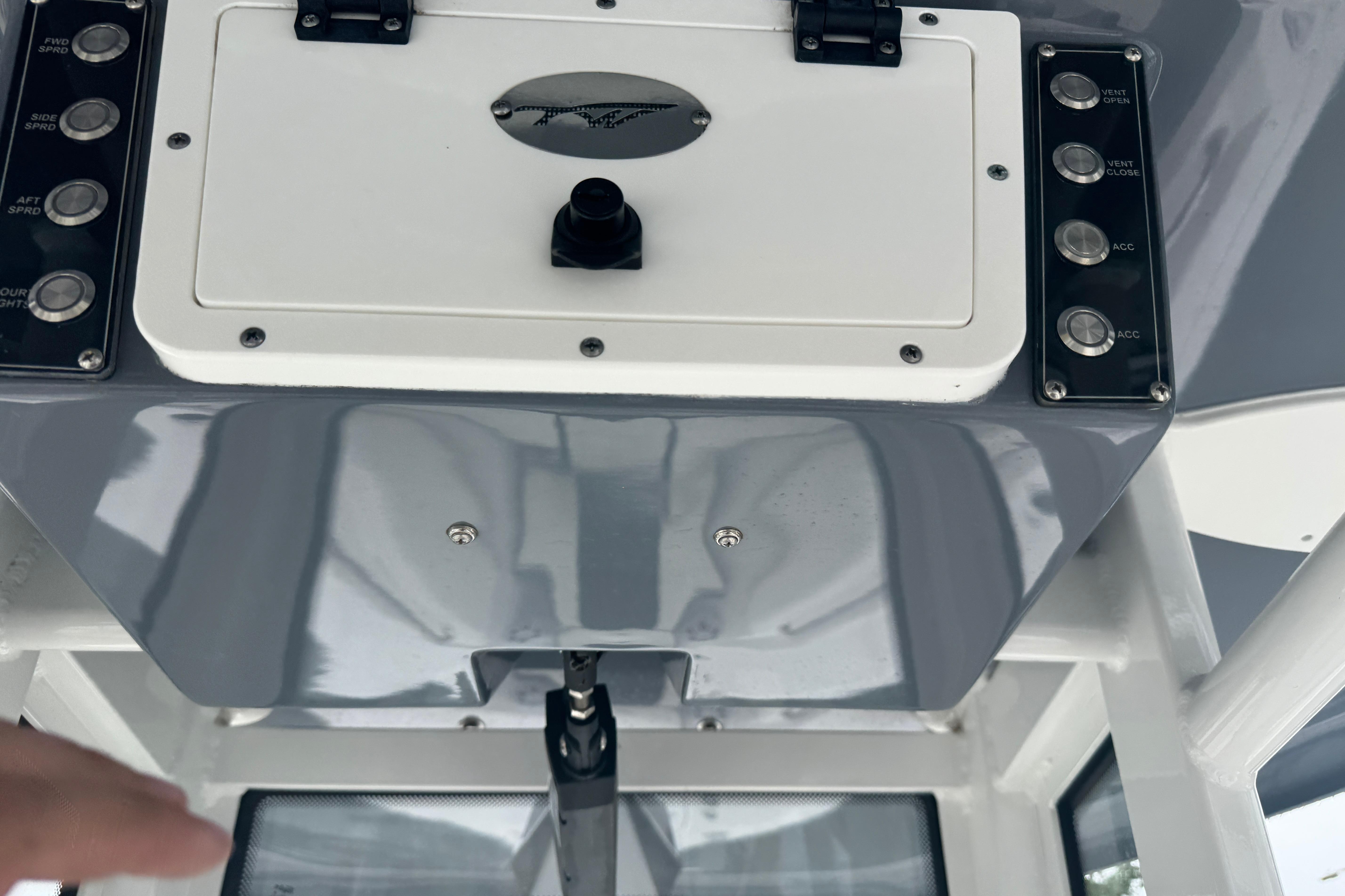 Control panel of a 2022 Tidewater 232 SS boat with various switches.