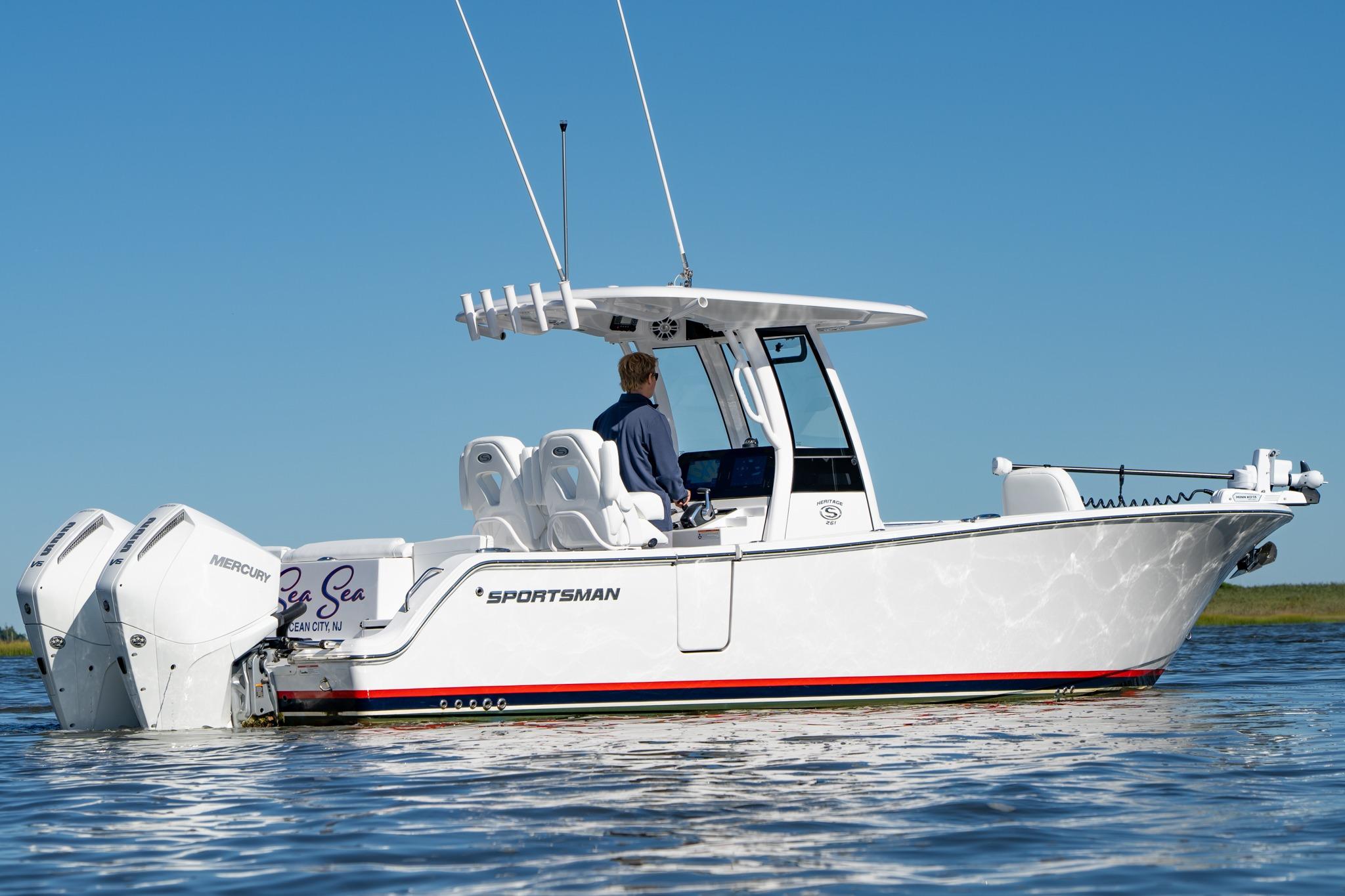 2024 Sportsman Heritage 261 Center Console boat on water, featuring dual Mercury engines.