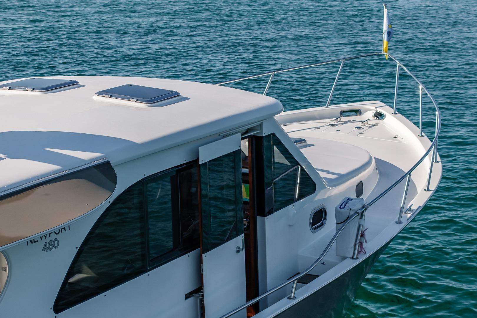2020 Island Gypsy Newport 460 yacht on calm blue water, showcasing sleek design.