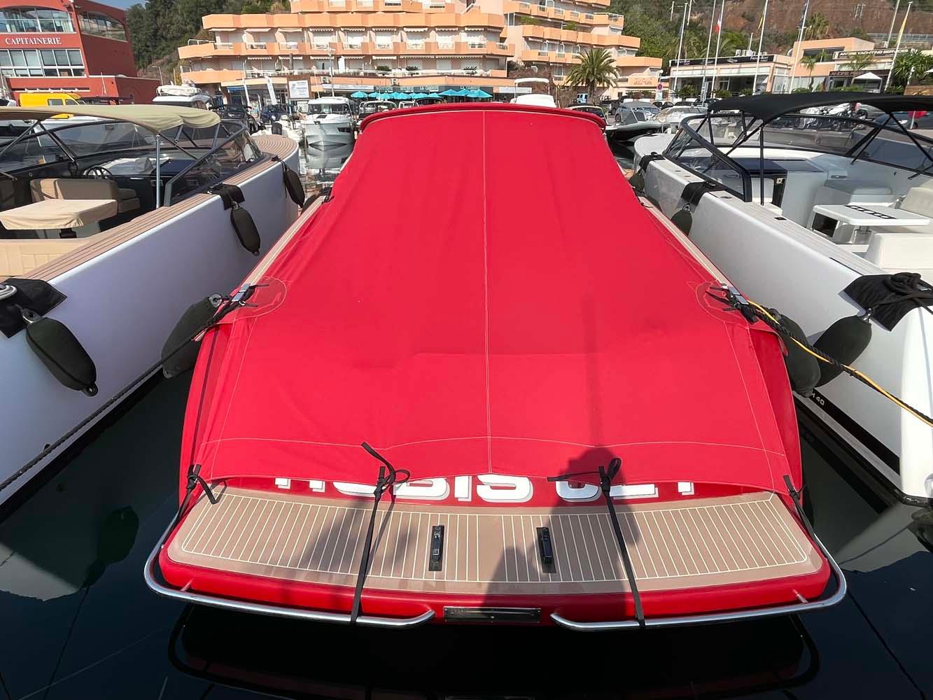 Red-covered 2011 VanDutch 40 yacht docked at marina.