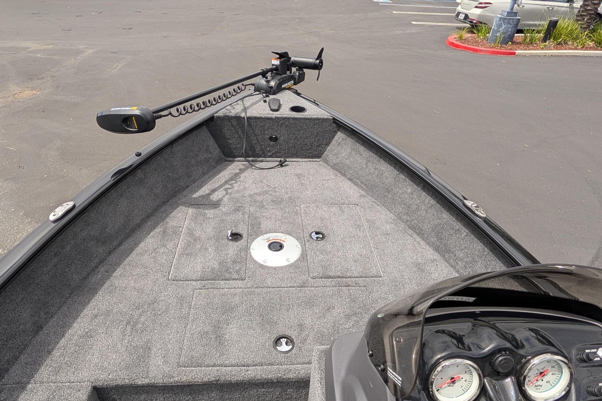 2026 Tracker Super Guide V-16 SC boat interior with trolling motor and dashboard.
