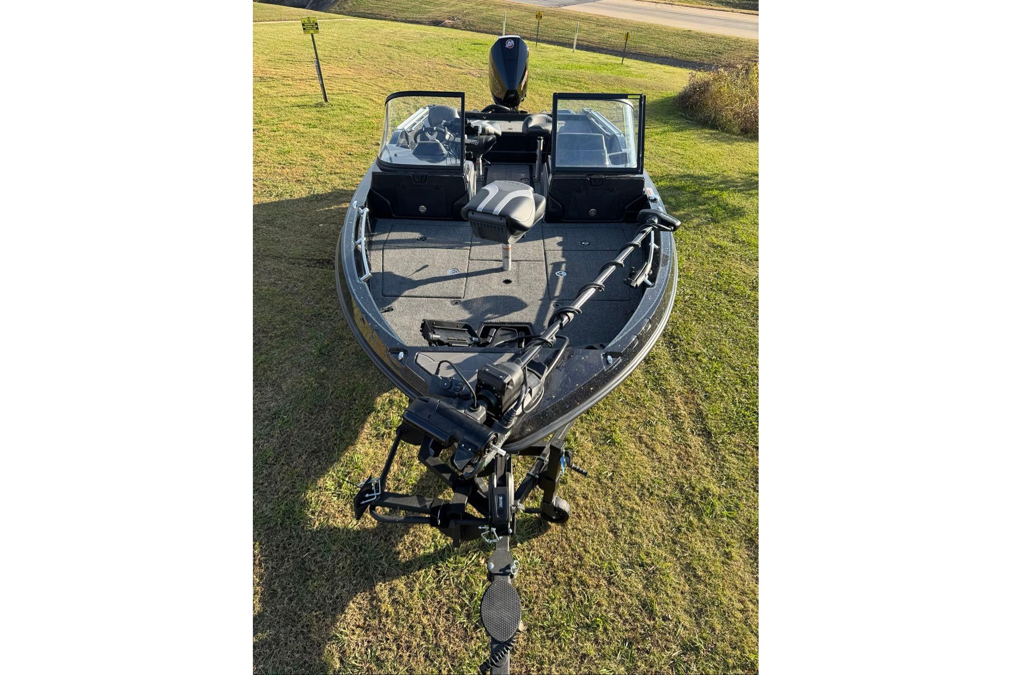 2026 Nitro ZV20 Pro fishing boat on grassy field, front view.