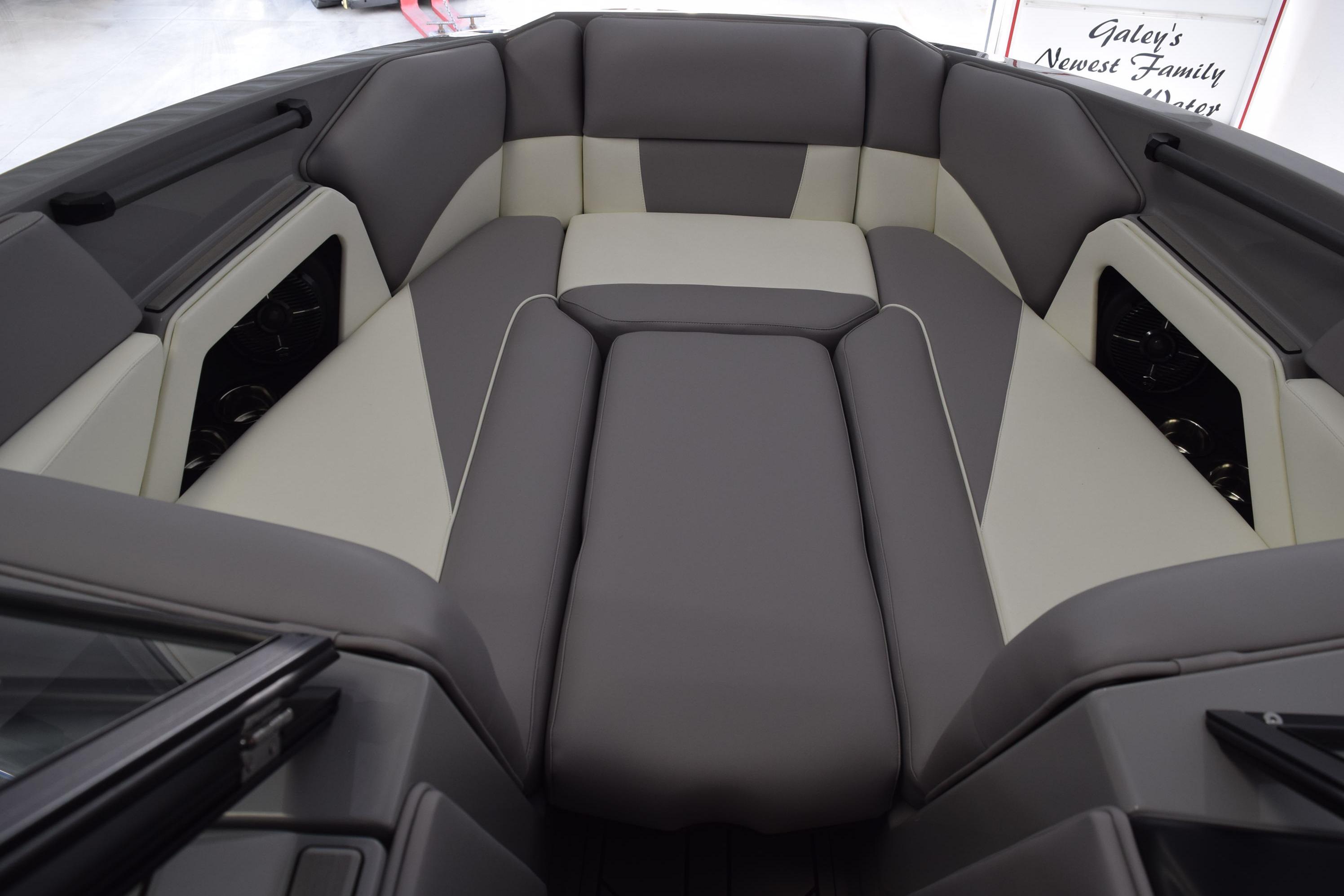 2026 Moomba Craz boat interior with gray and white cushioned seating.