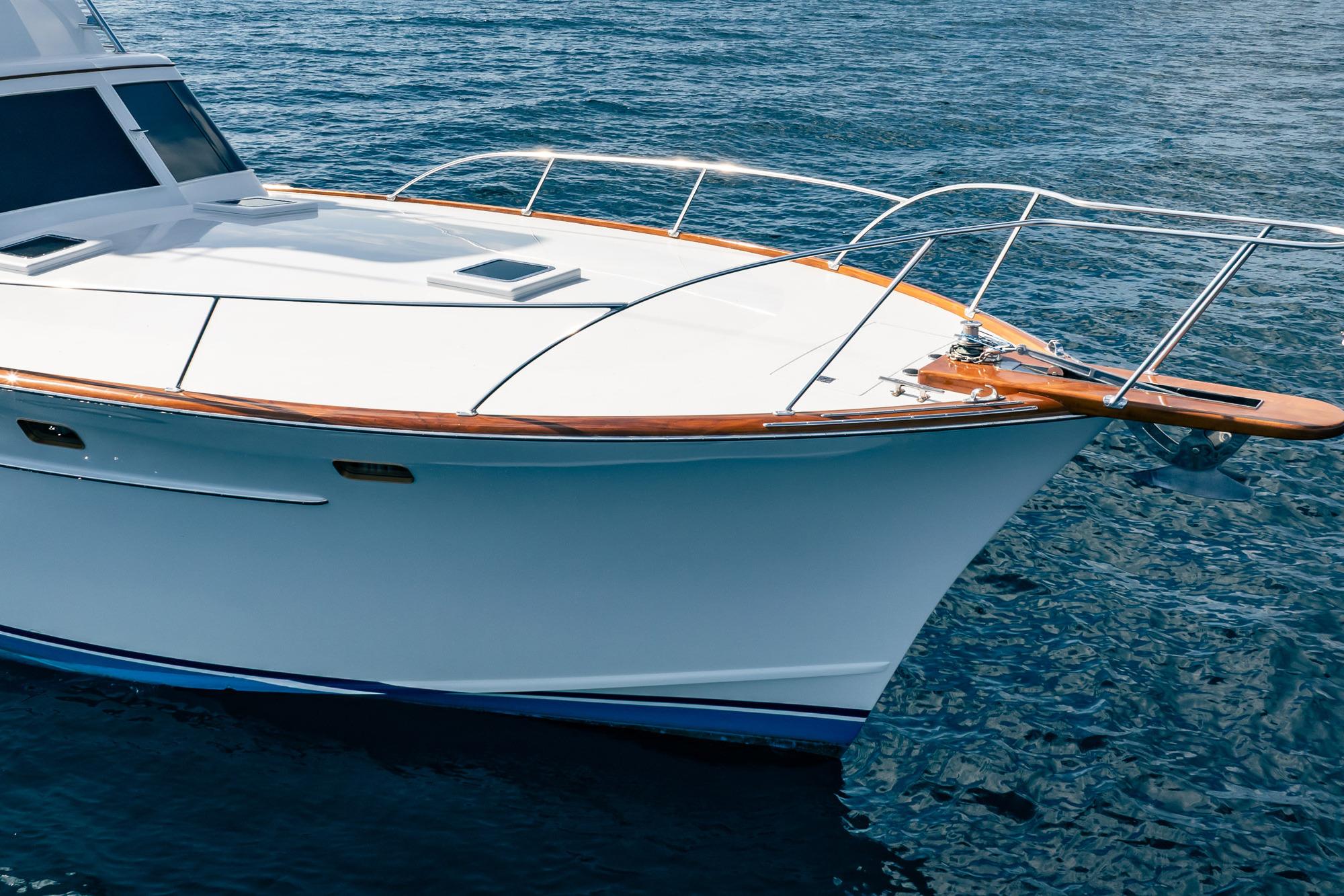 1983 Rybovich 55 Convertible yacht on calm blue water.
