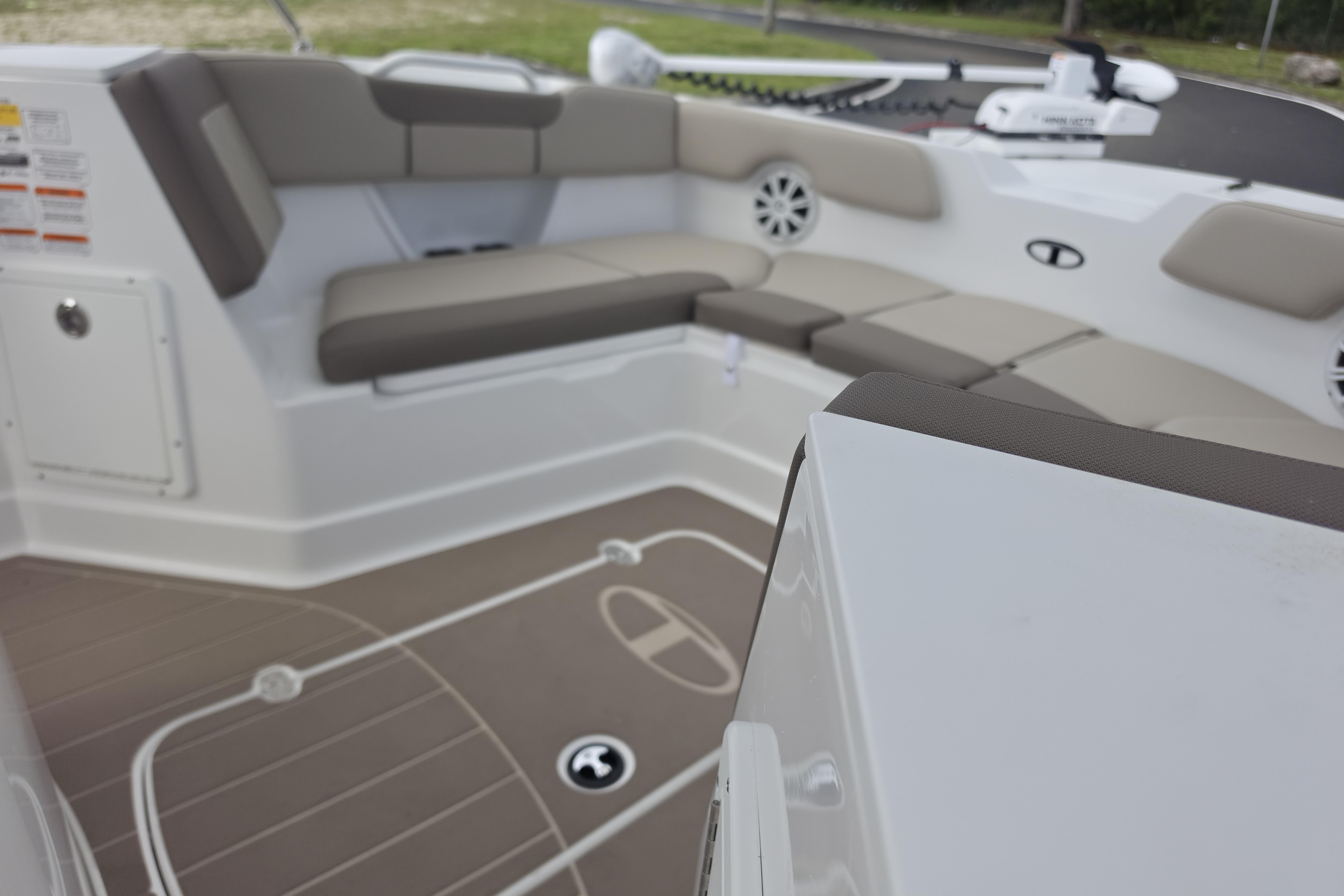 Interior view of 2026 Tahoe 2150 CC boat with cushioned seating and modern design.