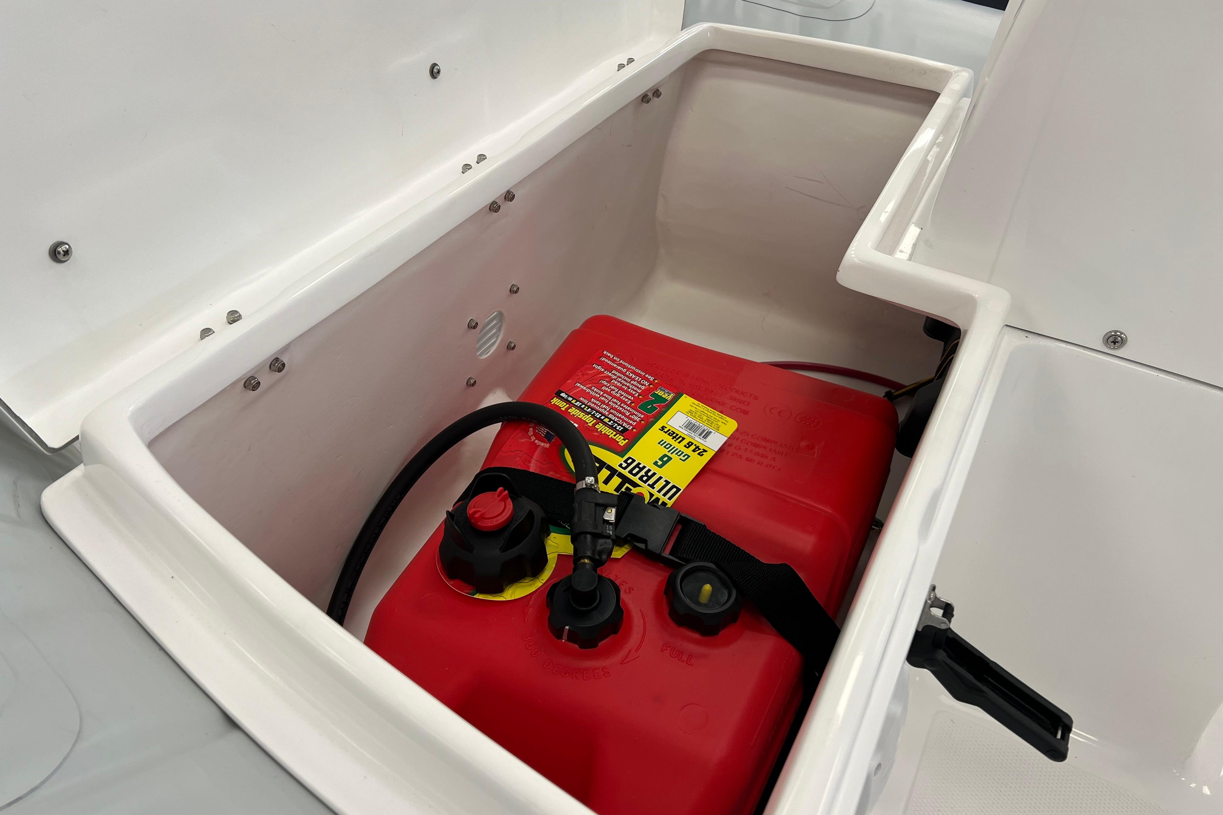 2023 AB Inflatables Mares 12 VSX storage compartment with red fuel tank.