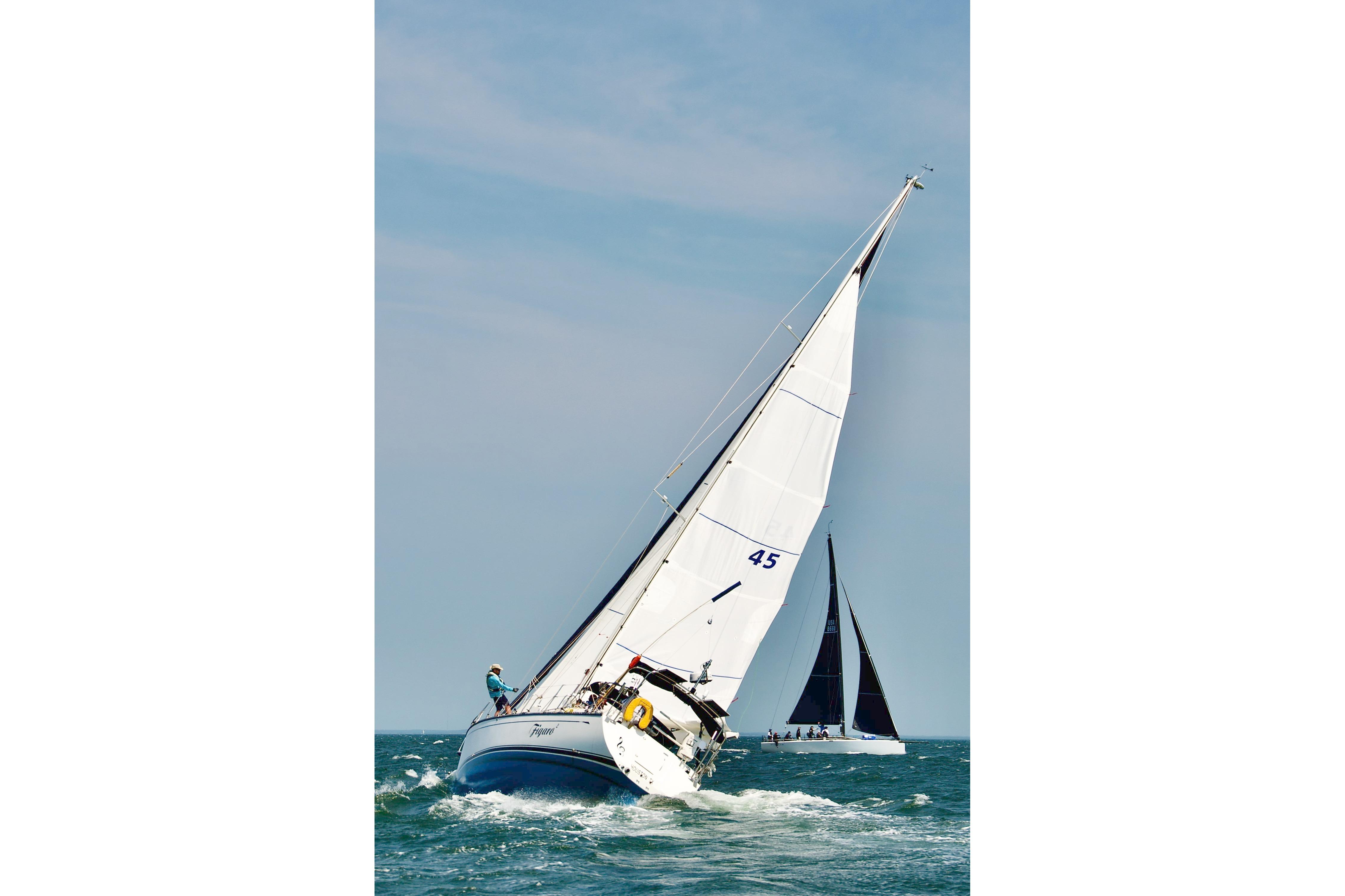 Sailing yacht Saga 43 from 2002 navigating ocean waters under clear skies.