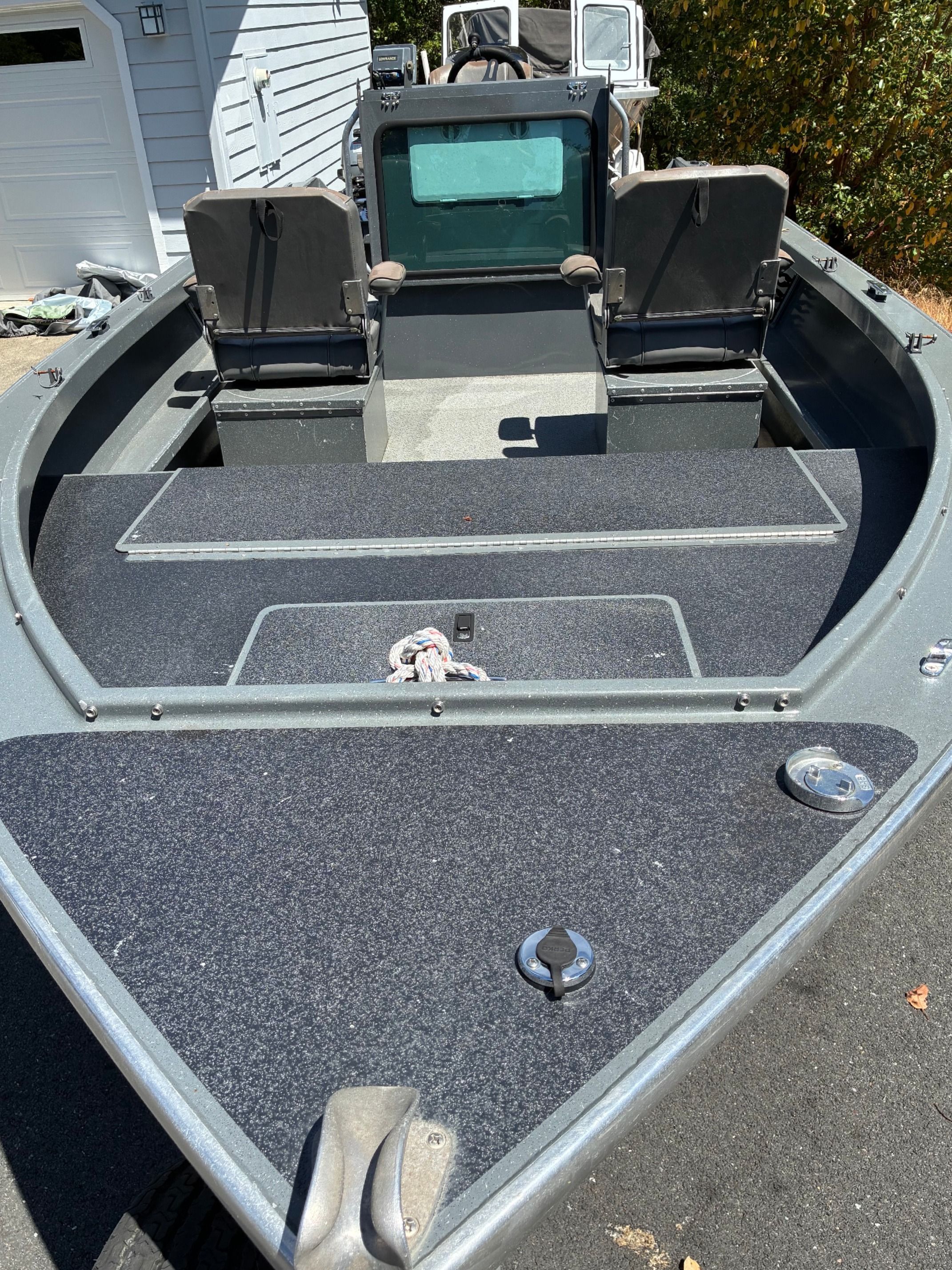 2003 North River SCOUT with a gray deck and two seats.