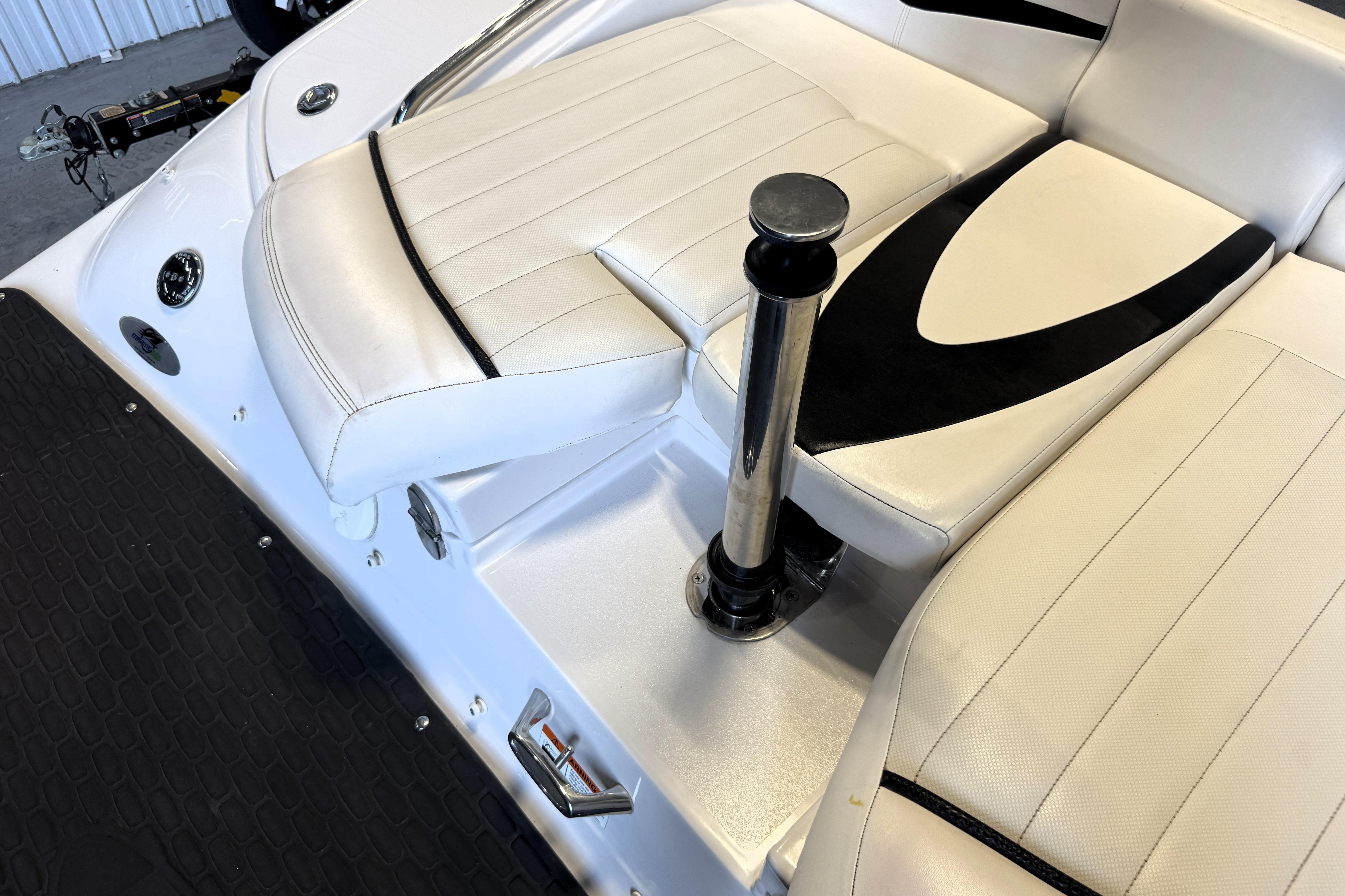 2008 Four Winns H240 boat interior with white seating and chrome details.