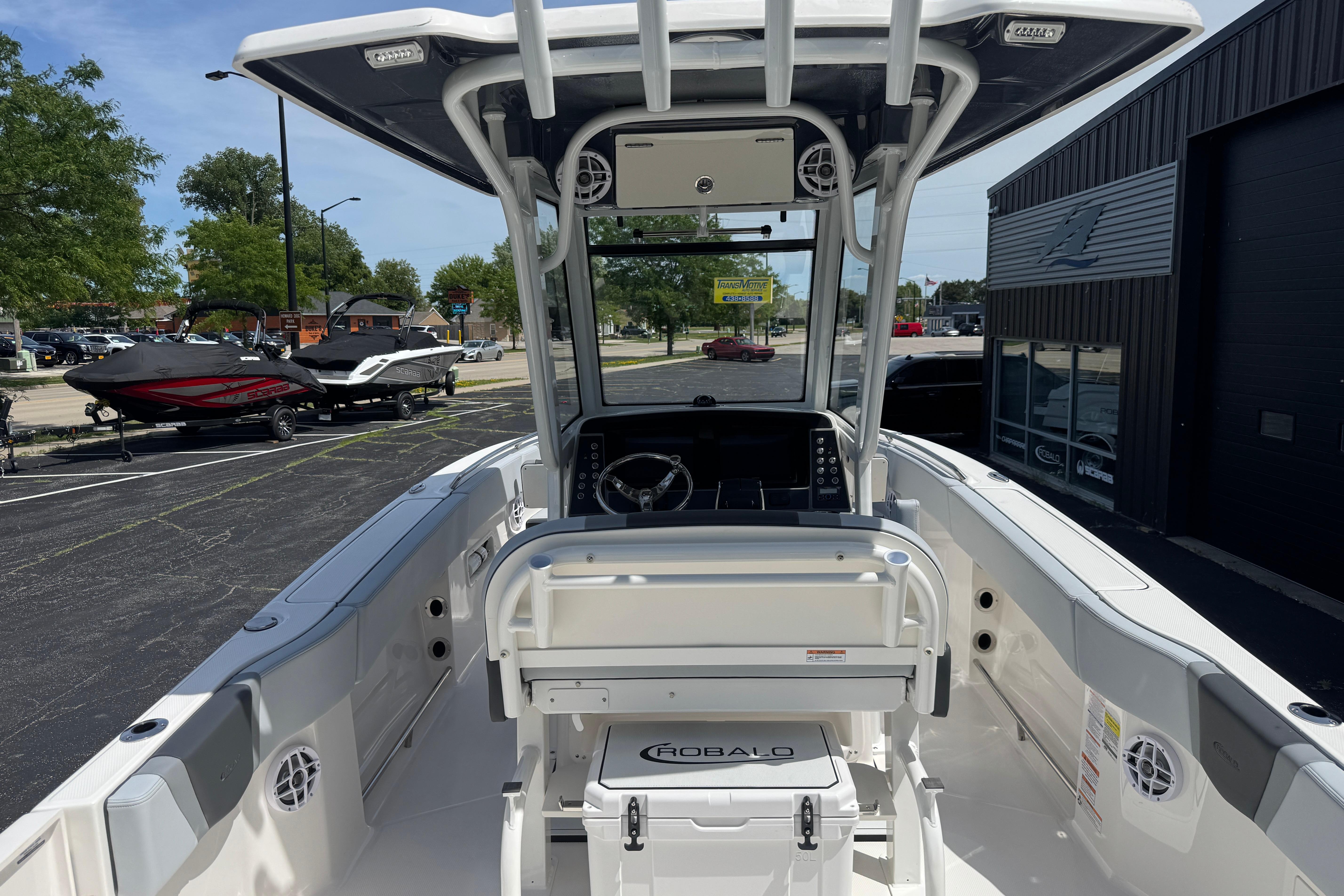 2026 Robalo R250 Center Console boat interior at dealership, showcasing helm and seating.