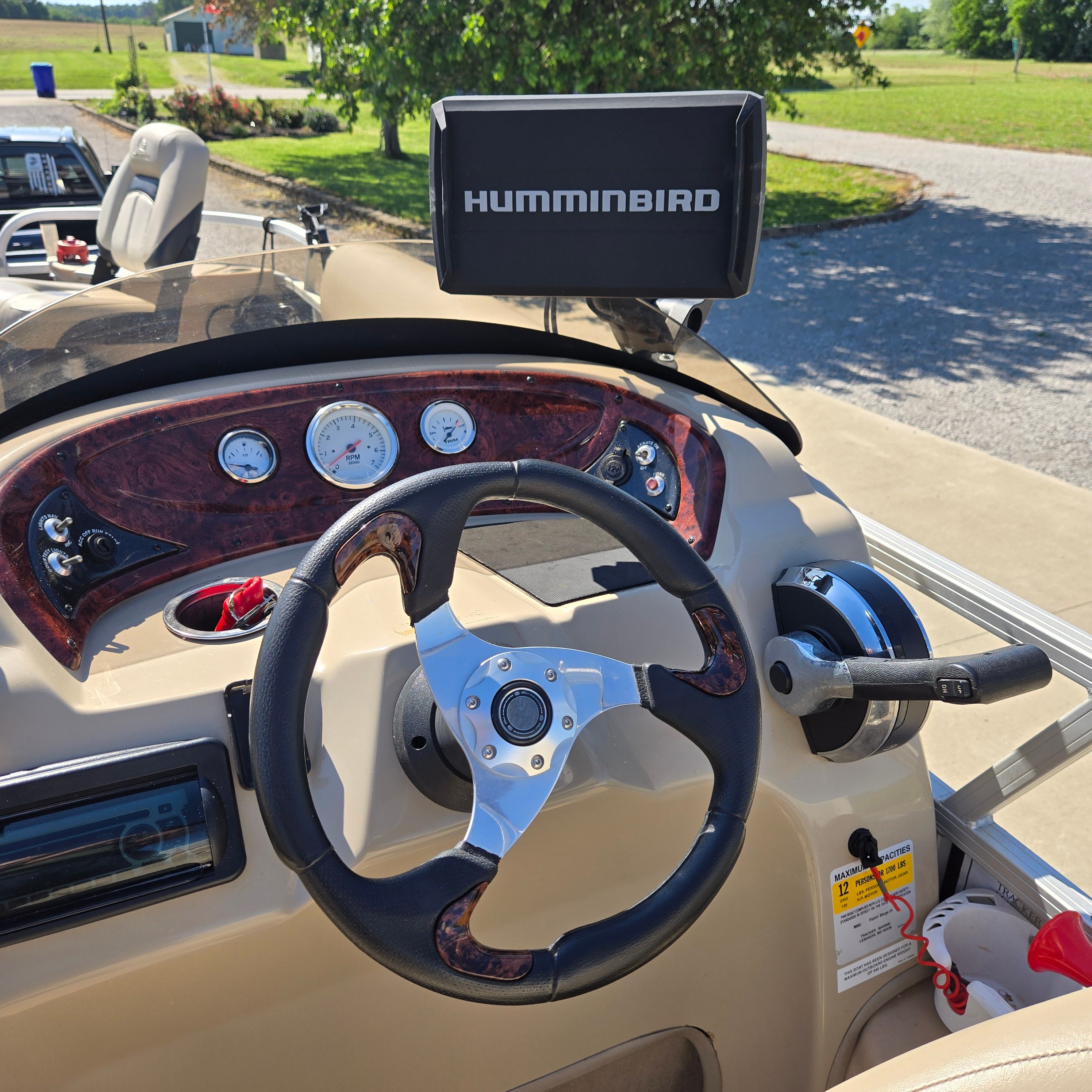 Helm of a Sun Tracker Fishin' Barge 24 DLX with Humminbird fish finder.