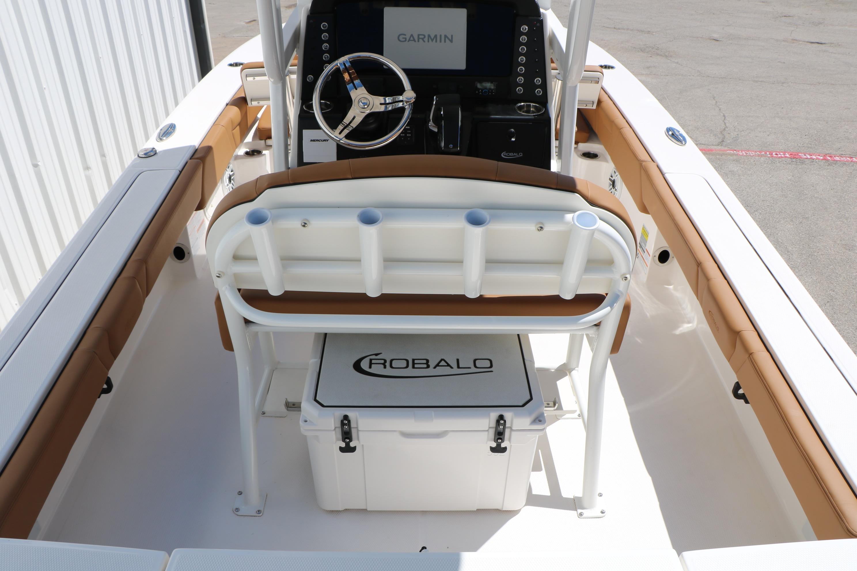 2026 Robalo 246 Cayman boat interior with Garmin navigation and Robalo cooler.