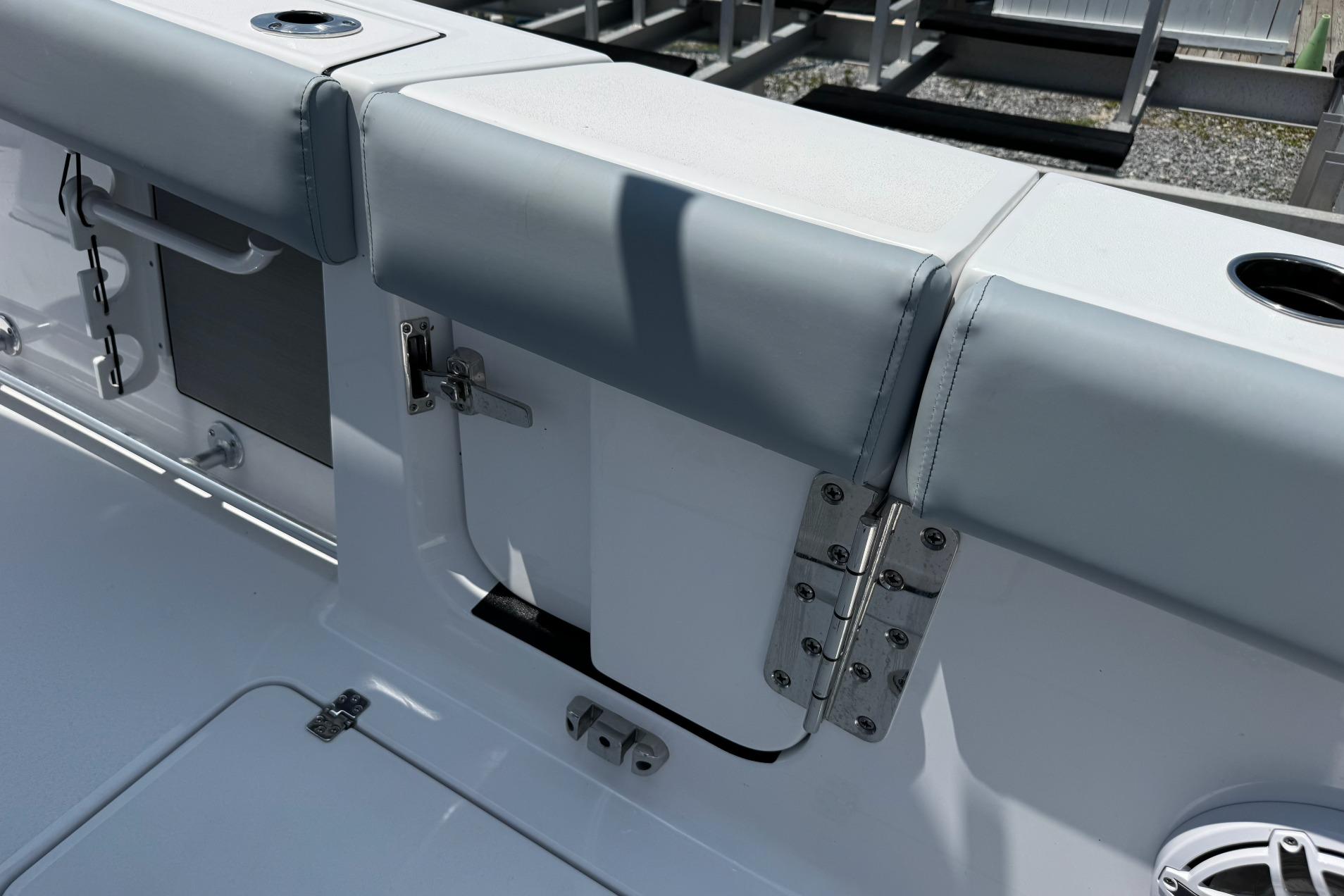 2026 Sportsman Open 262 Center Console boat interior with cushioned seating and stainless steel hardware.