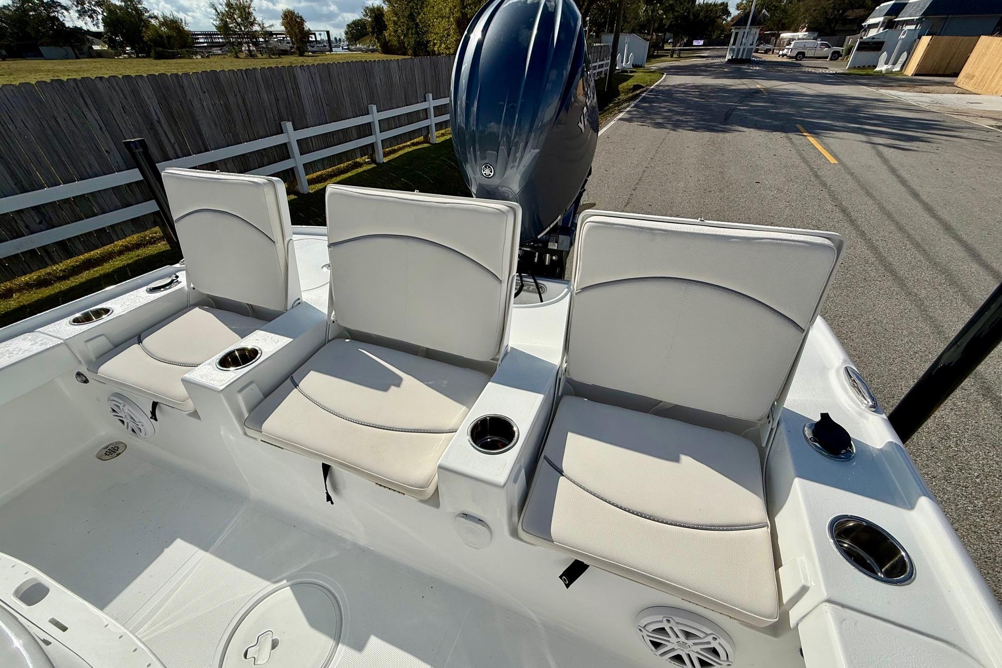 2026 Sea Hunt BX 22 BR boat with three cushioned seats and cup holders.