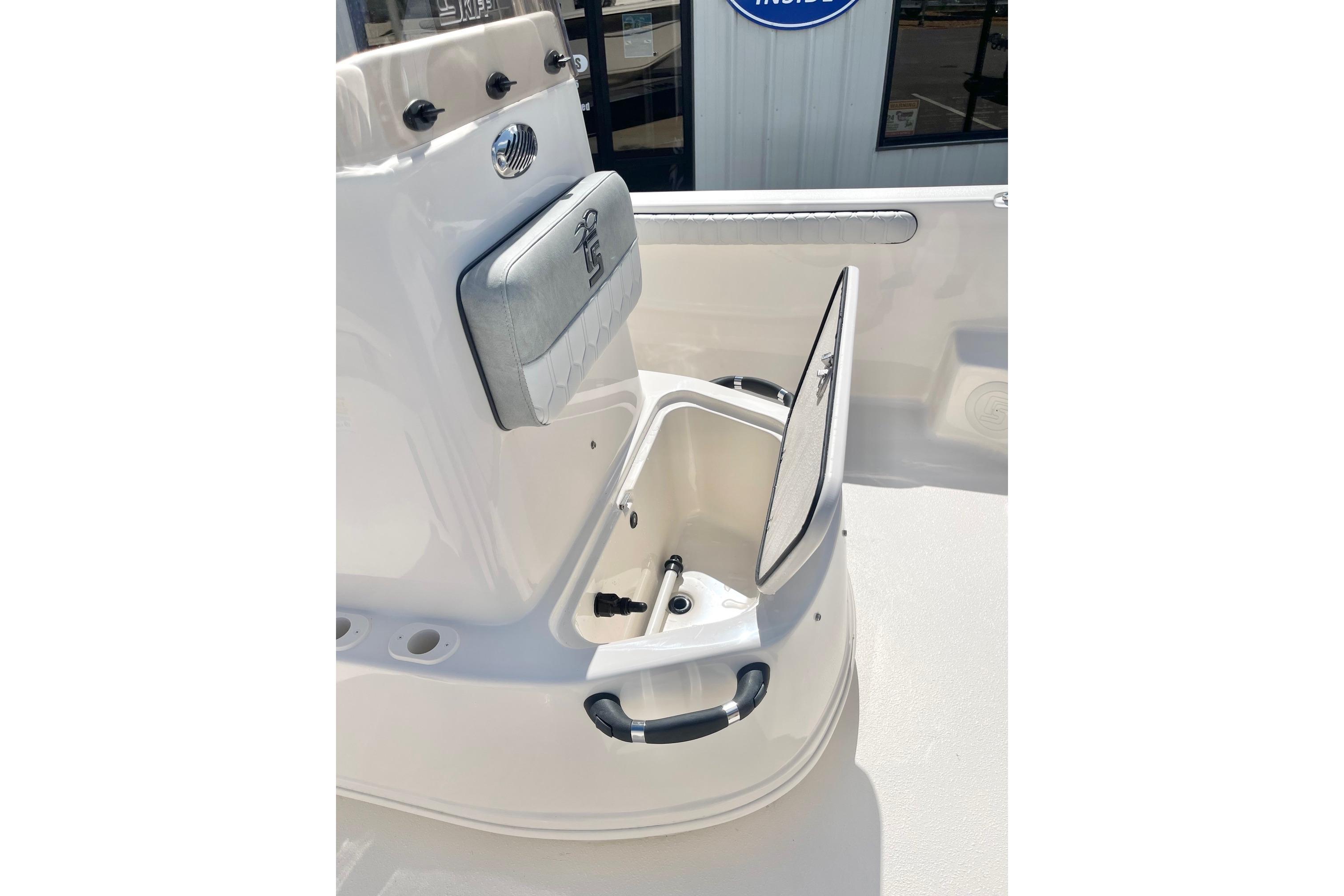 2026 Carolina Skiff 19 LS boat interior with open storage compartment.