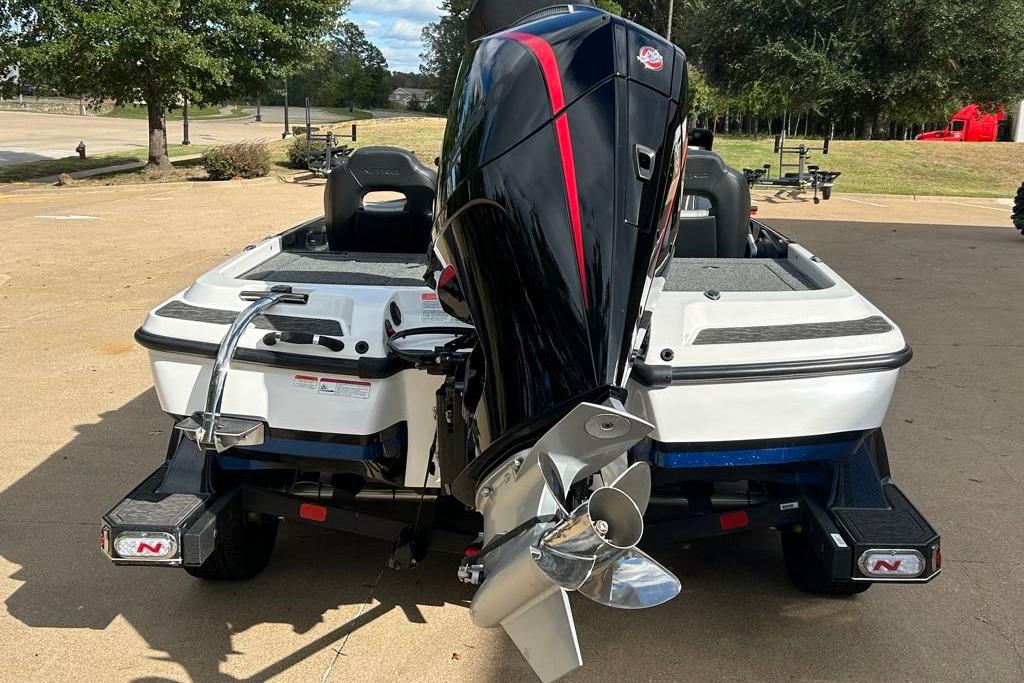 2026 Nitro Z21 XL Pro boat with powerful outboard motor, parked outdoors.