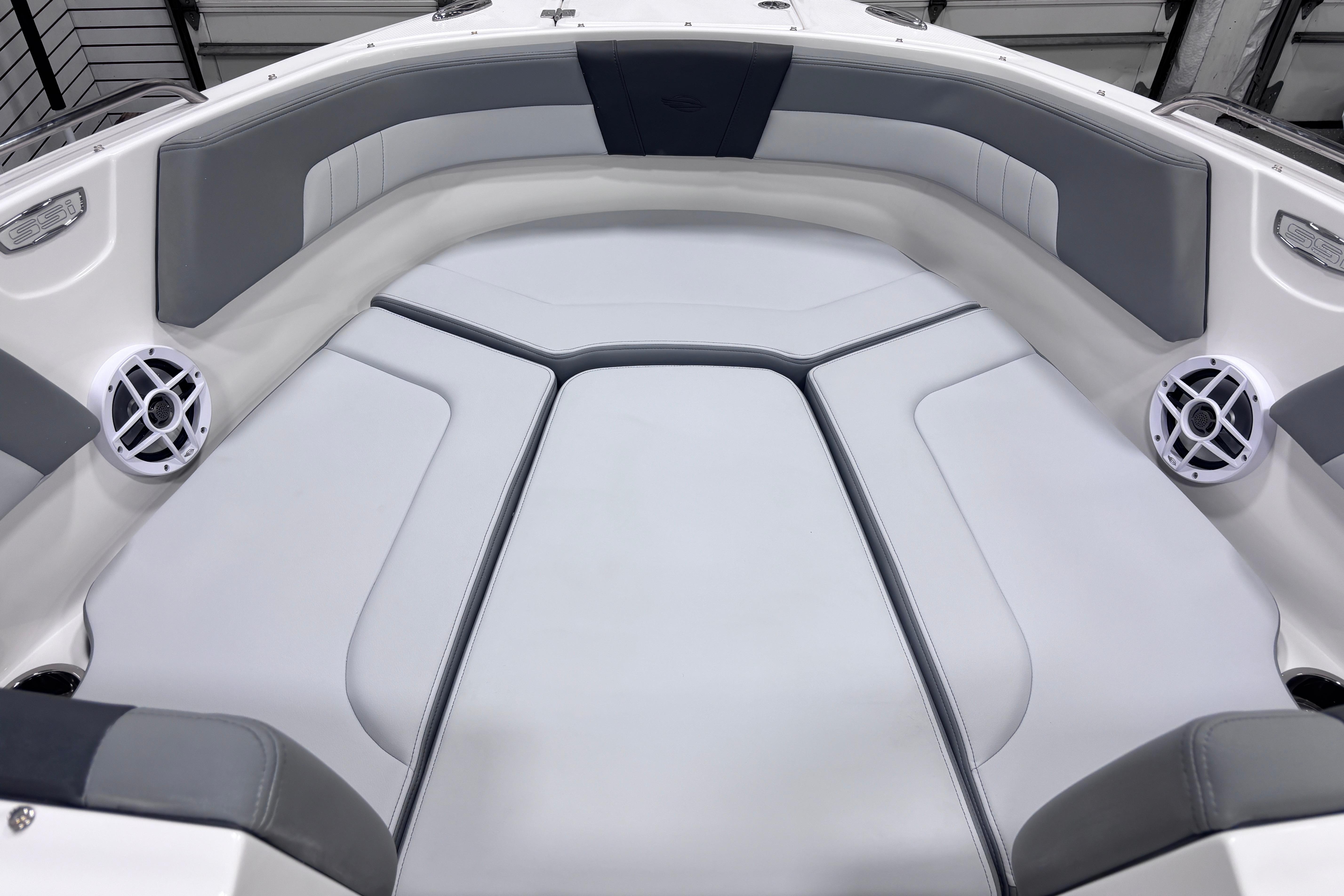 2026 Chaparral 23 SSi boat interior with gray seating and built-in speakers.