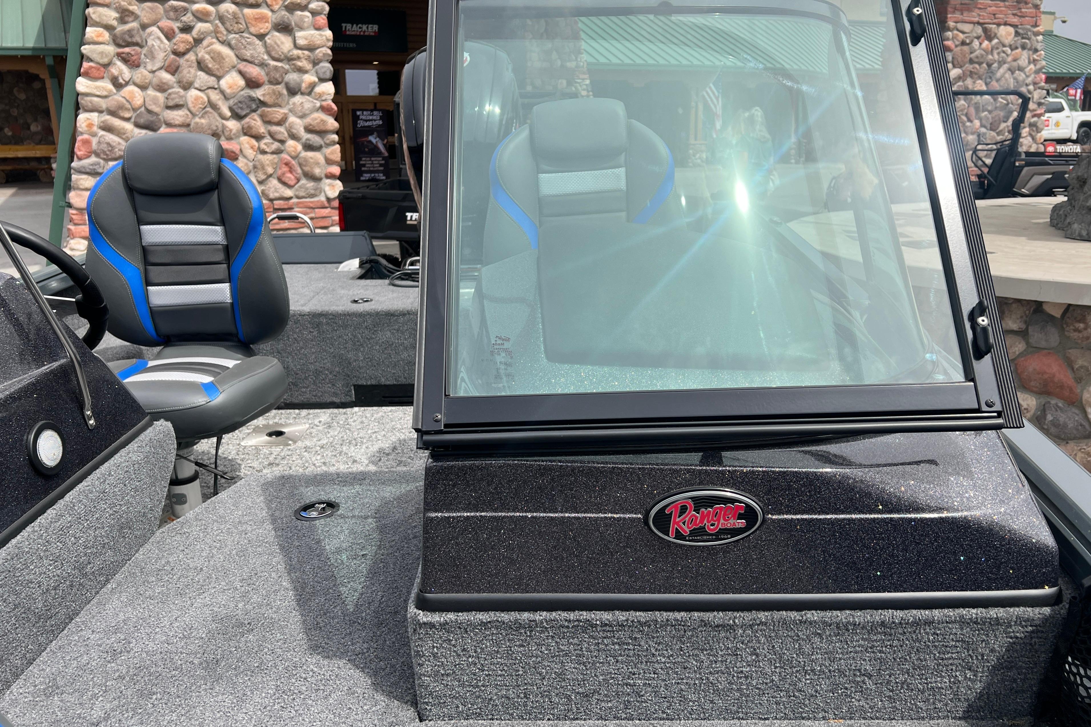 2026 Ranger VS1682SC Angler boat with windshield and seating, outdoor display.