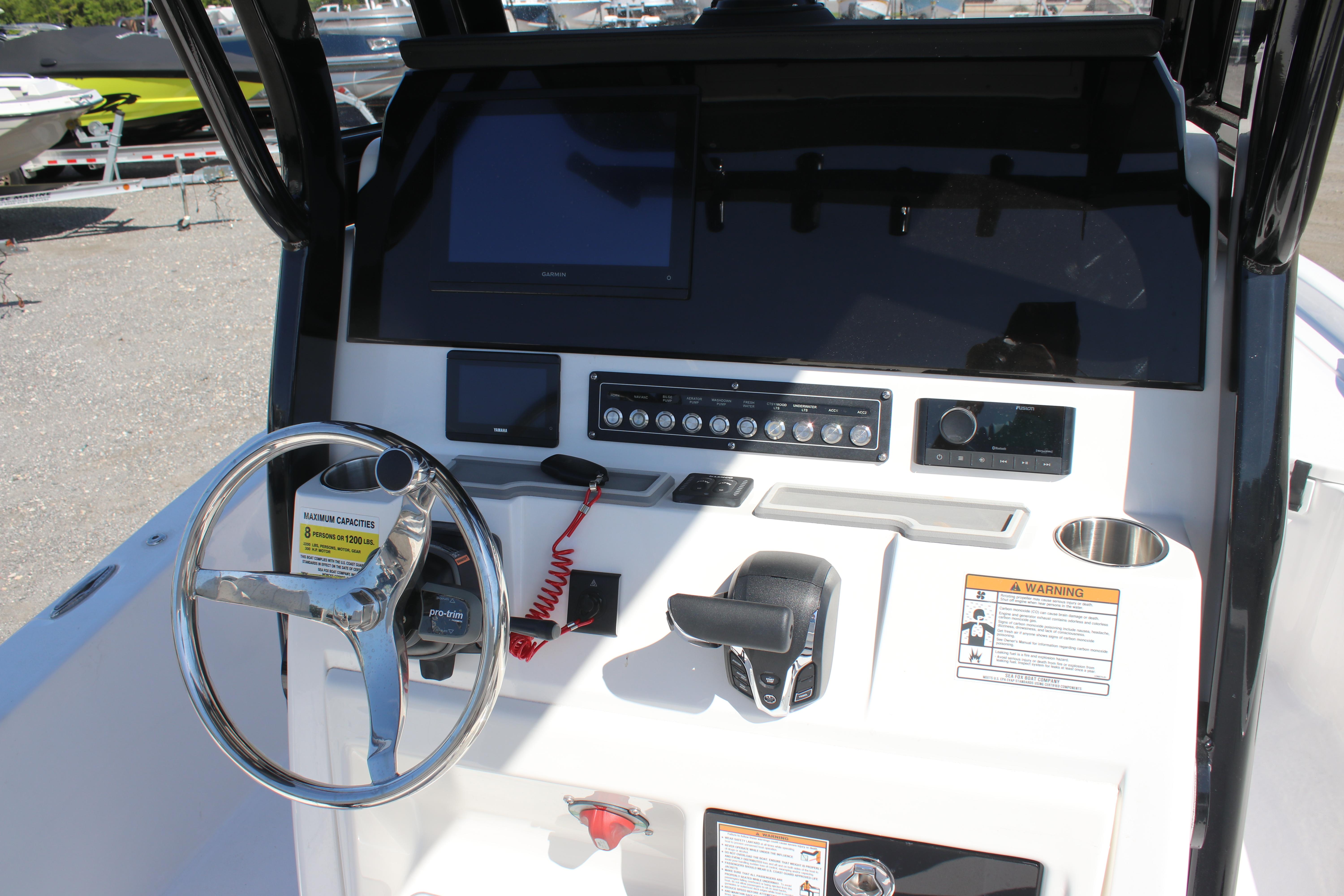 2025 Sea Fox 251 Bay Fox boat console with steering wheel and control panel.