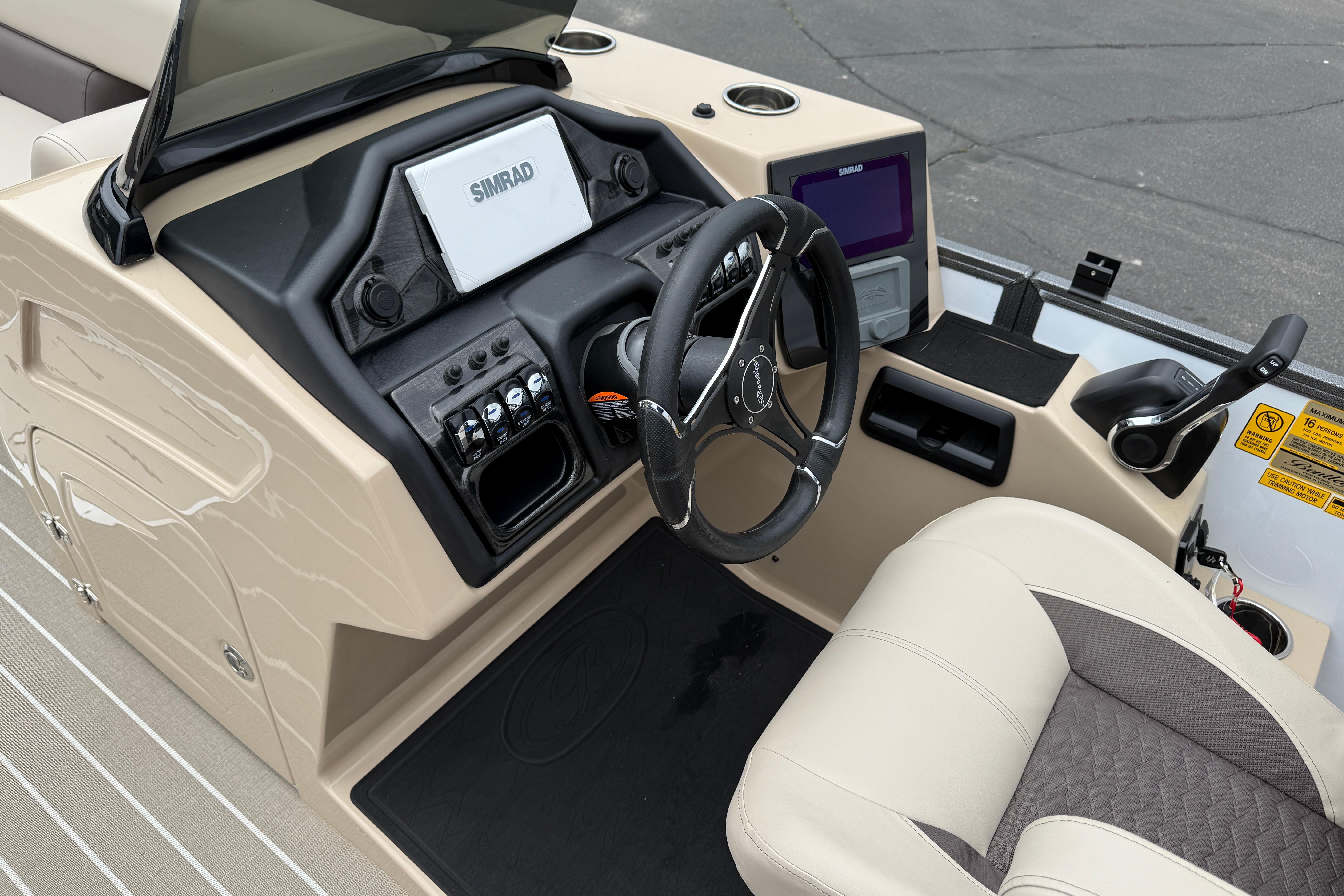 2026 Bentley Pontoons Elite 253 Admiral dashboard with steering wheel and control panel.