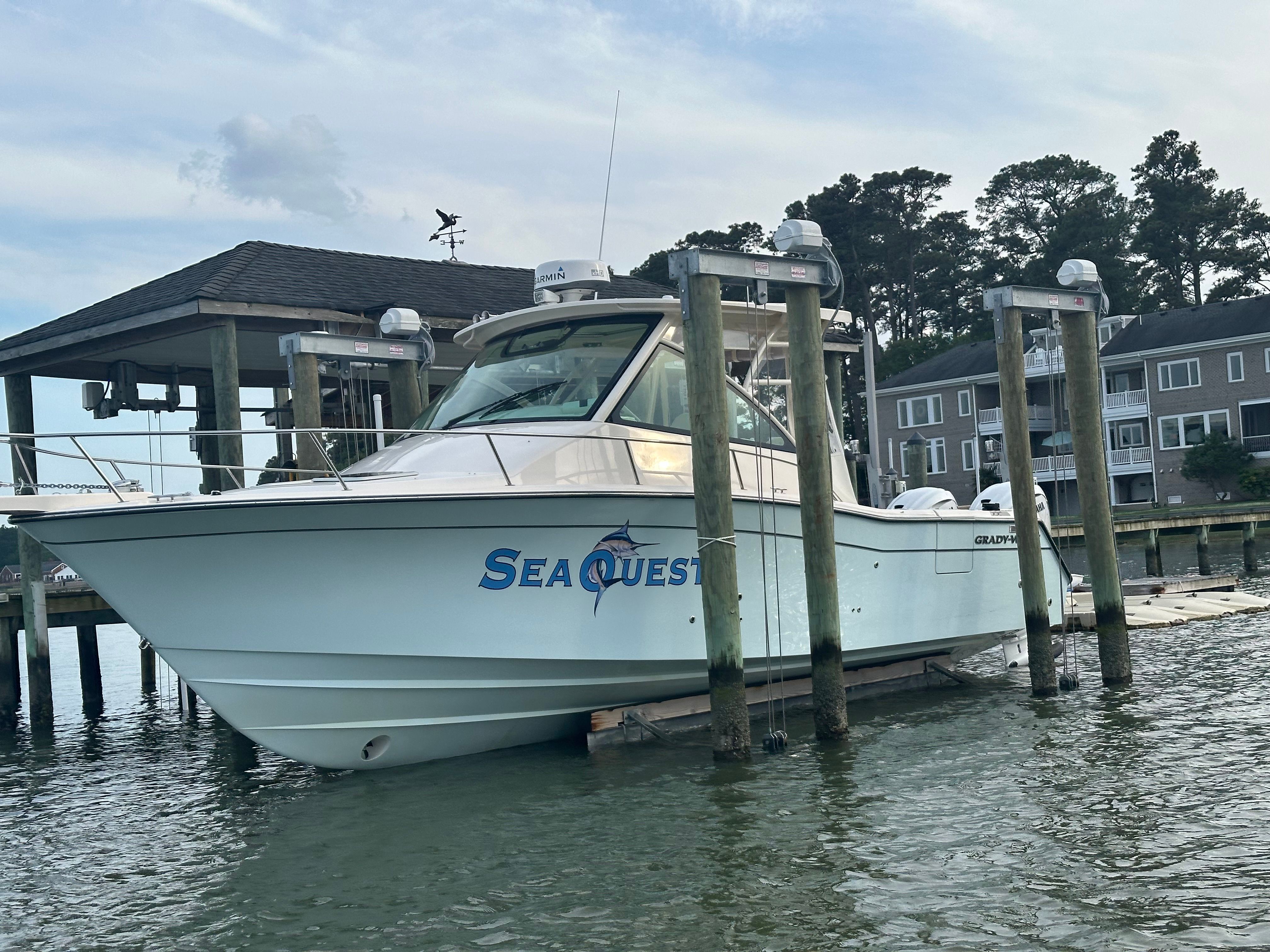 2022 Grady-White Express 330 boat docked at marina.