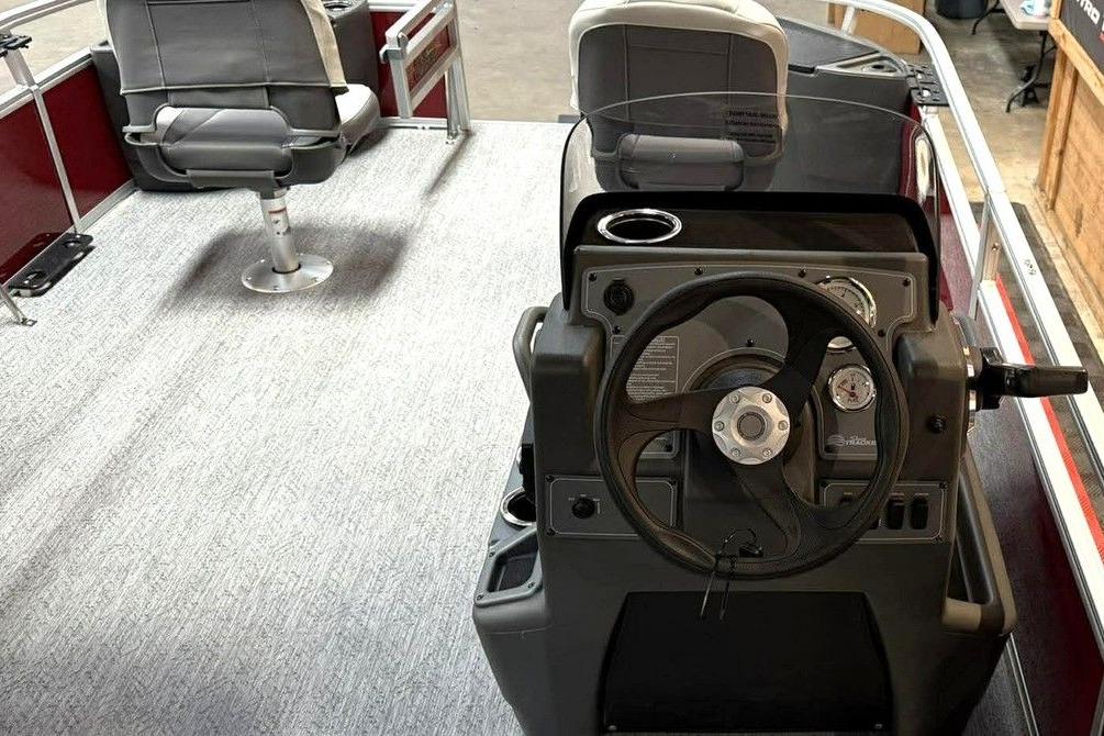 2026 Sun Tracker Bass Buggy 18 DLX interior with steering console and seating.