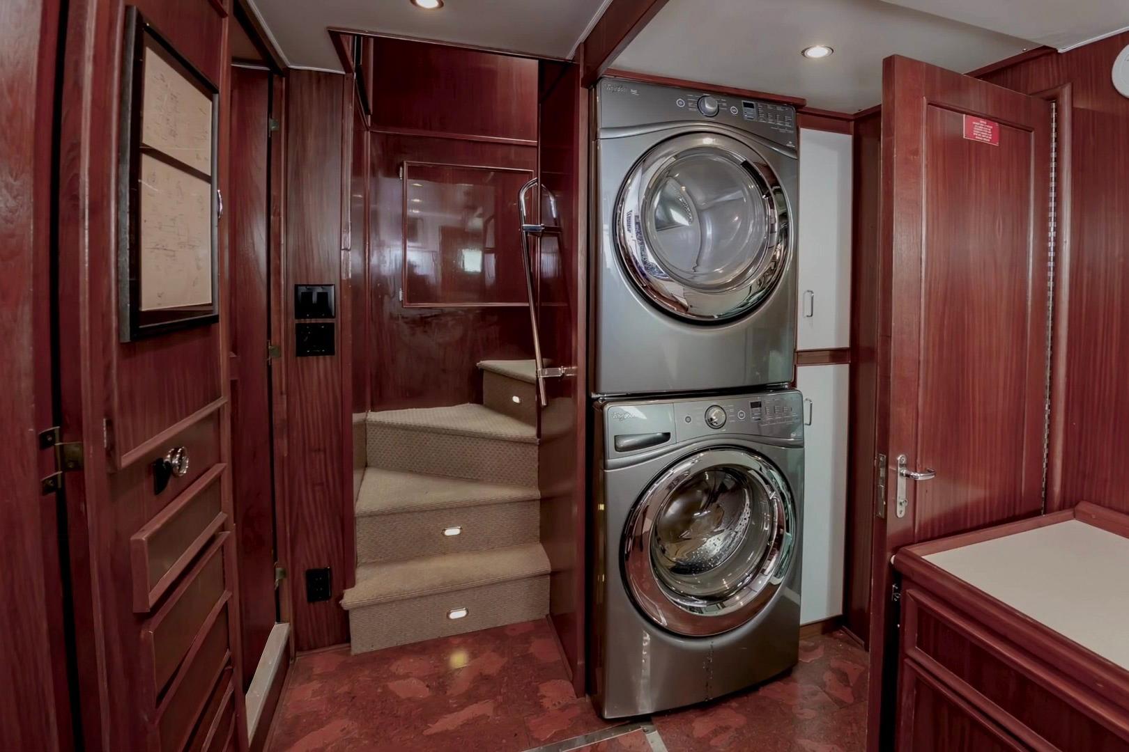 Interior of 1980 Hatteras 70 Motor Yacht with stacked washer and dryer.