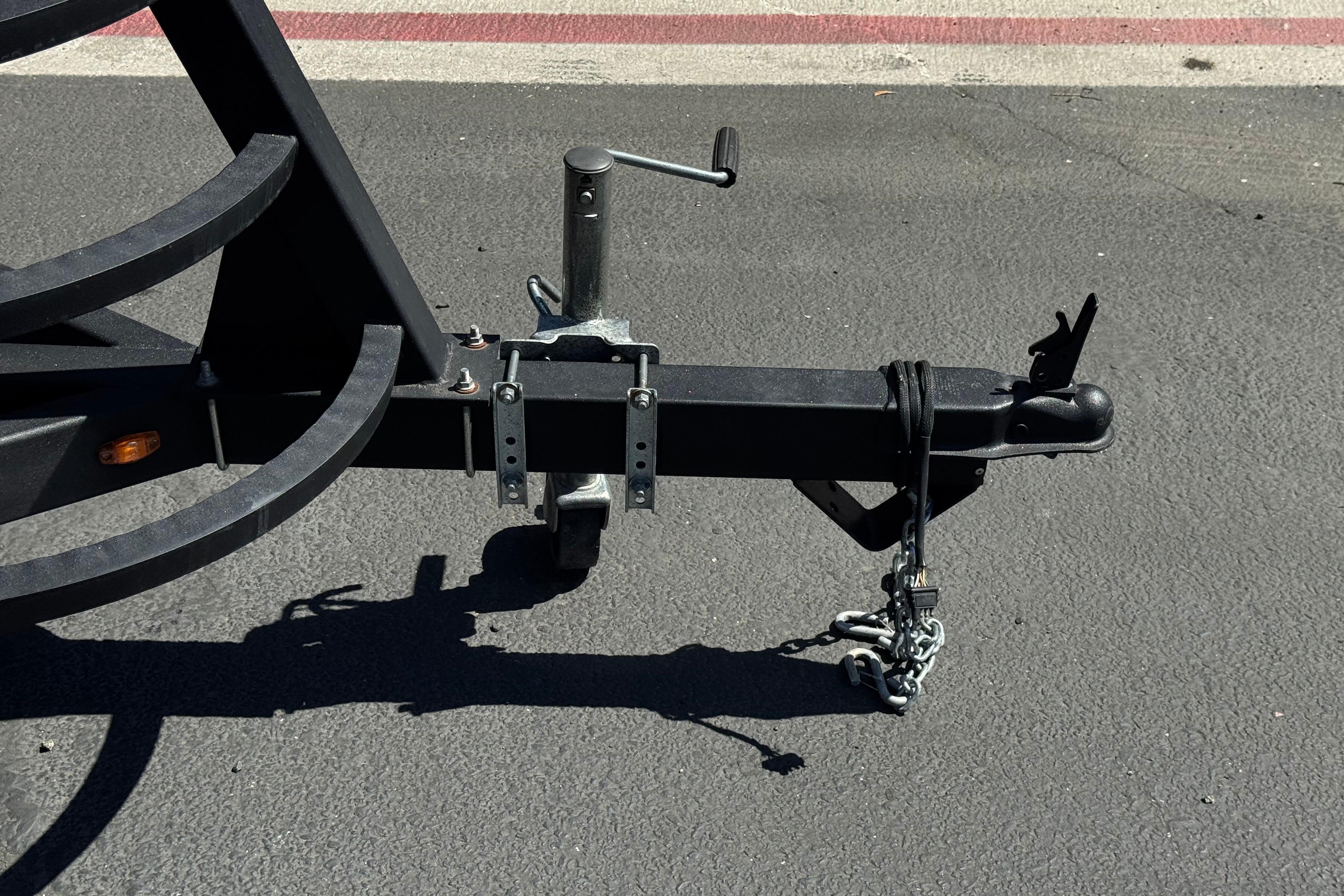 Trailer hitch of 2021 SunCatcher Select 20RCX on asphalt surface.
