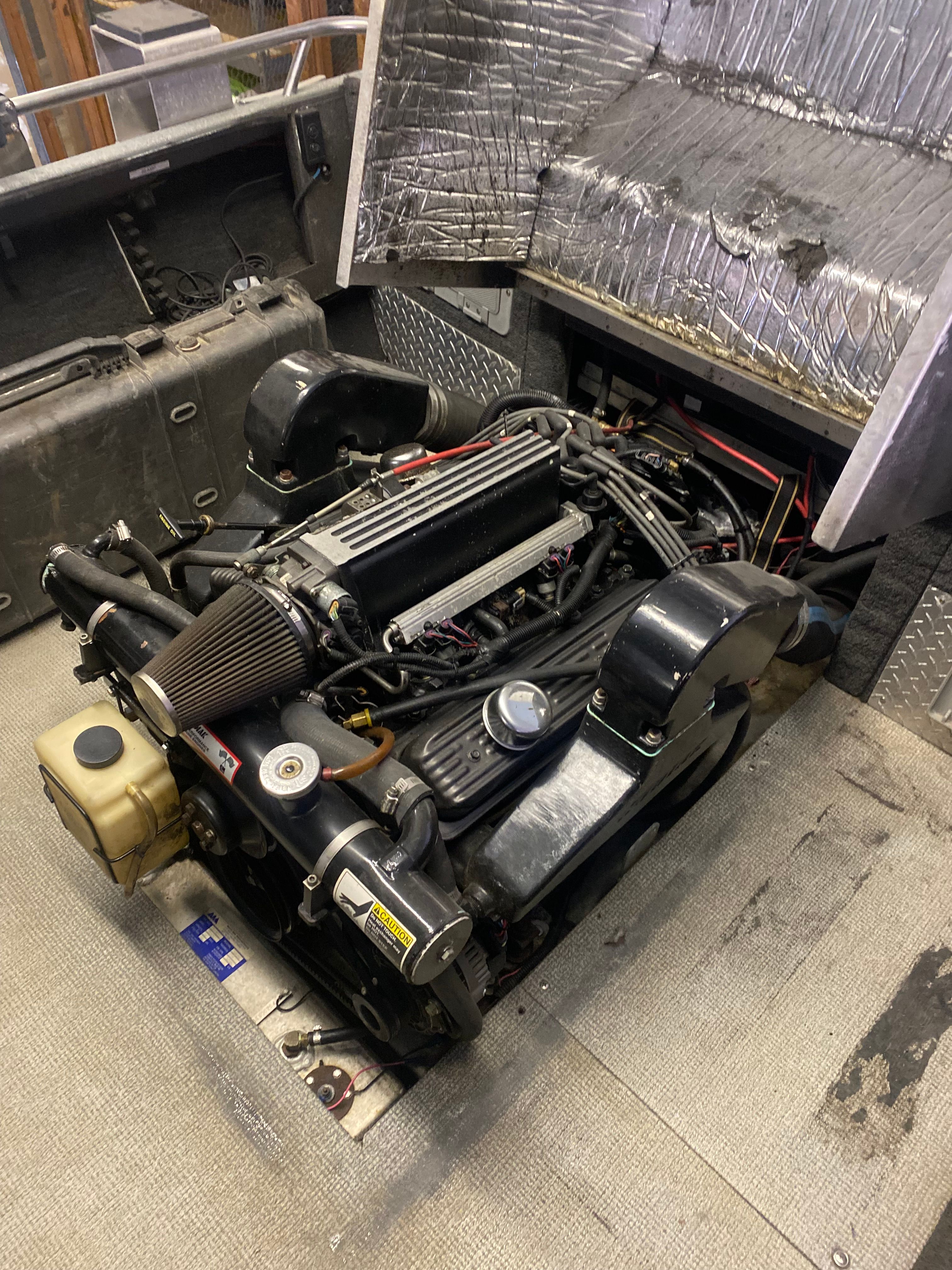 Engine of a 1993 Jetcraft Fastwater boat, open for maintenance.