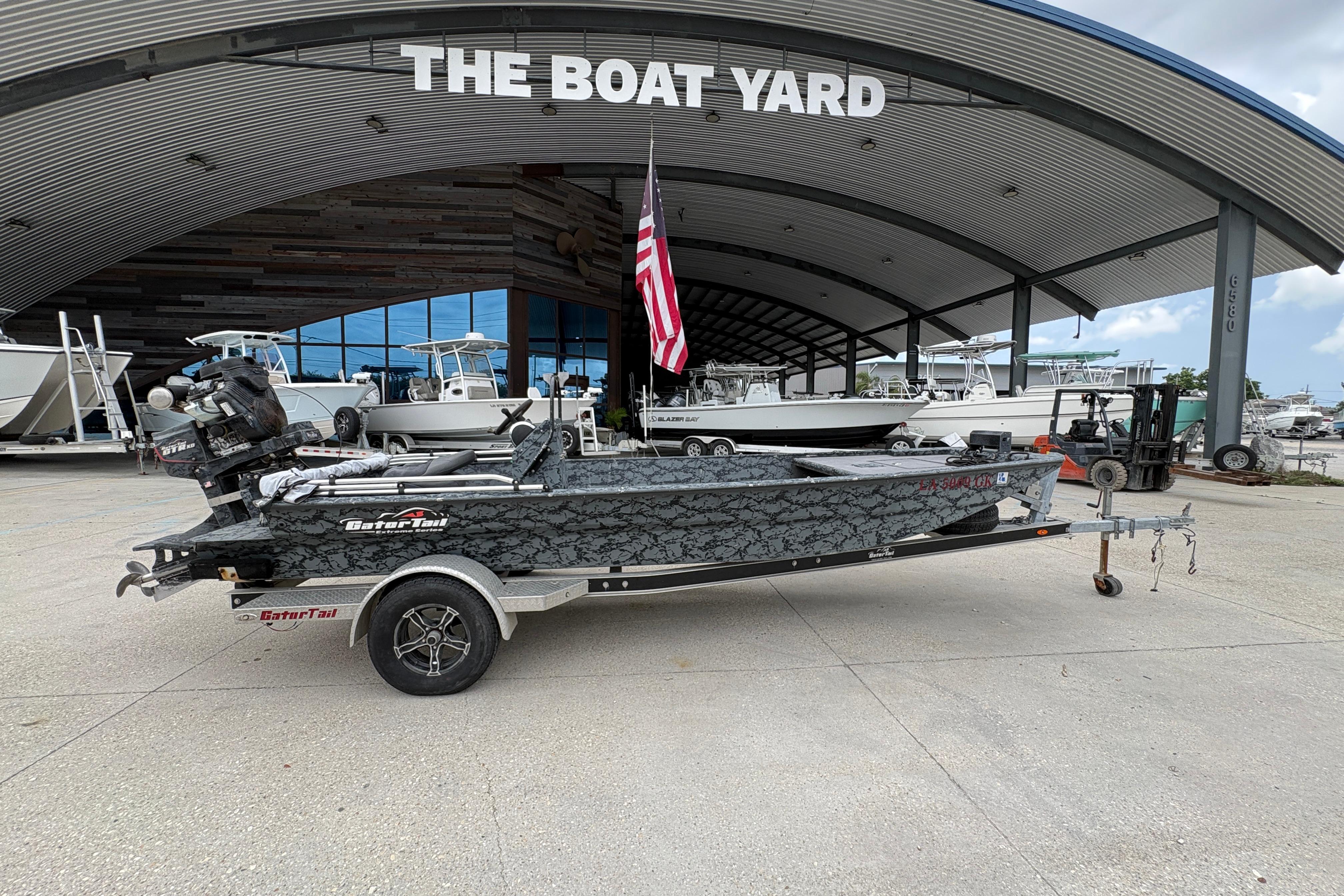 2020 Gator Tail Extreme boat on trailer at The Boat Yard, featuring camouflage design.