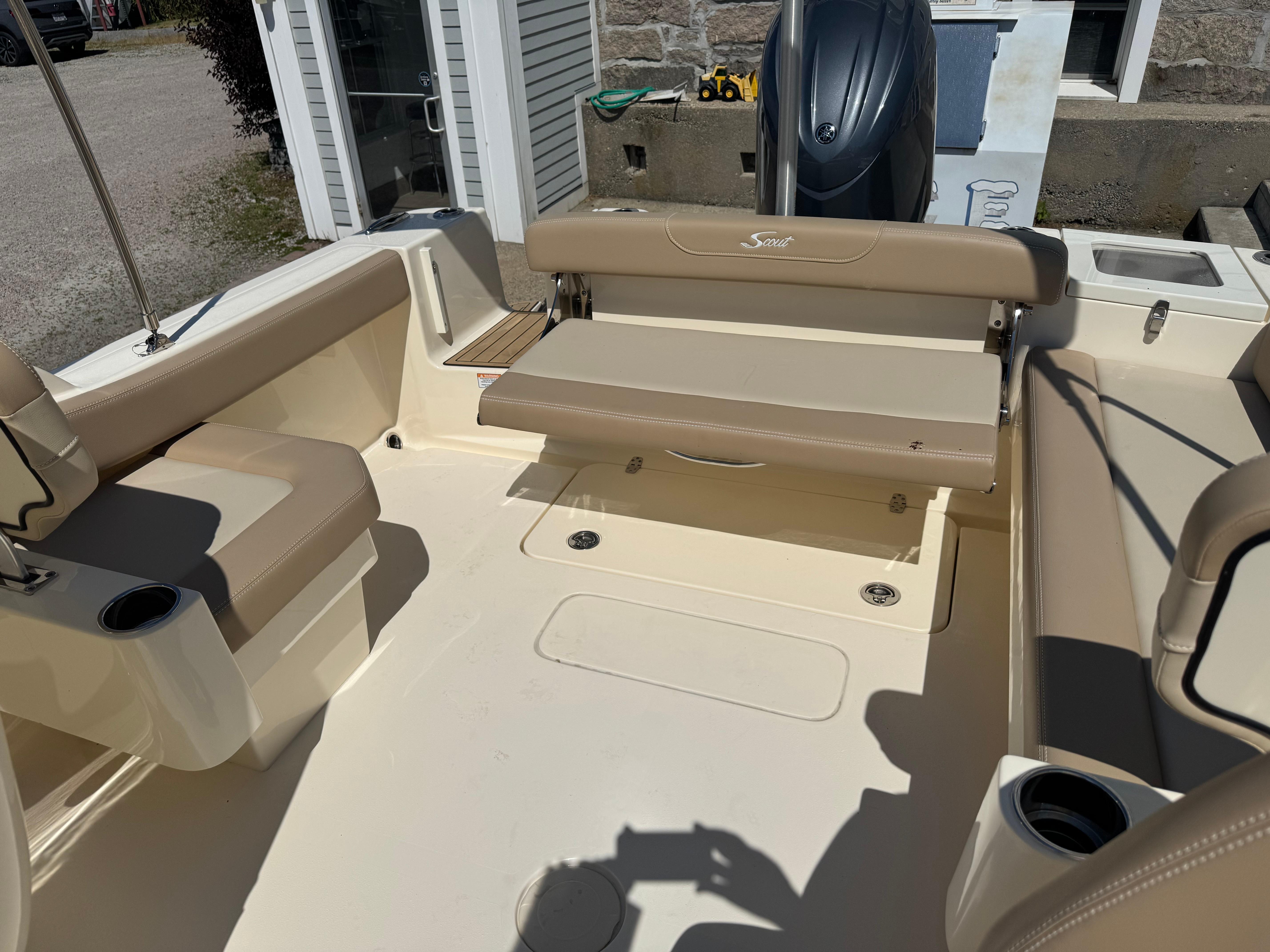2025 Scout 215 Dorado boat interior with beige seating and cup holders.