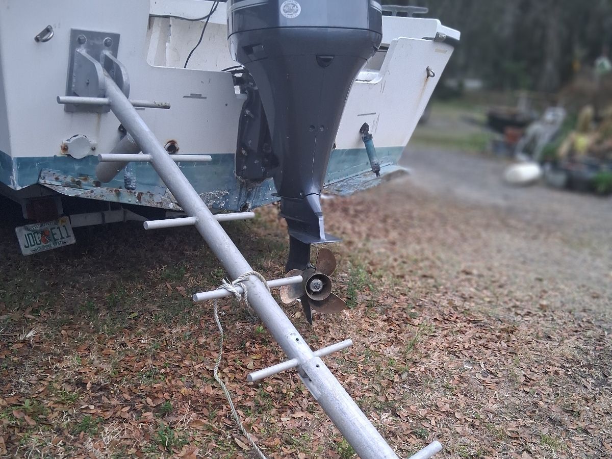 1987 Parker Sou'wester boat with outboard motor on land.