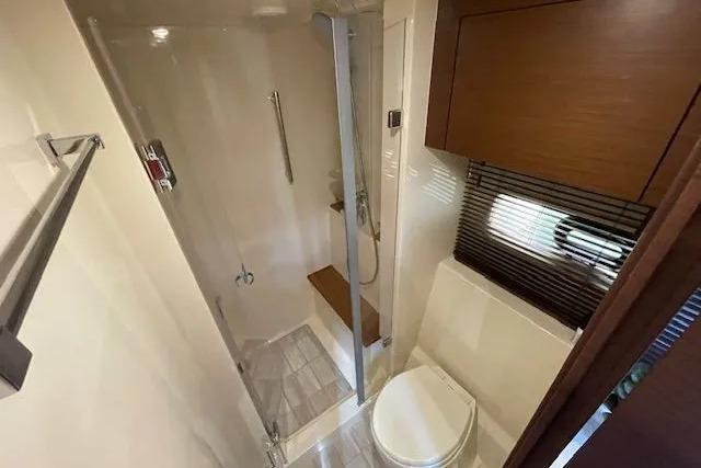 Luxurious bathroom in 2016 Sea Ray Sundancer 510 yacht with shower and toilet.