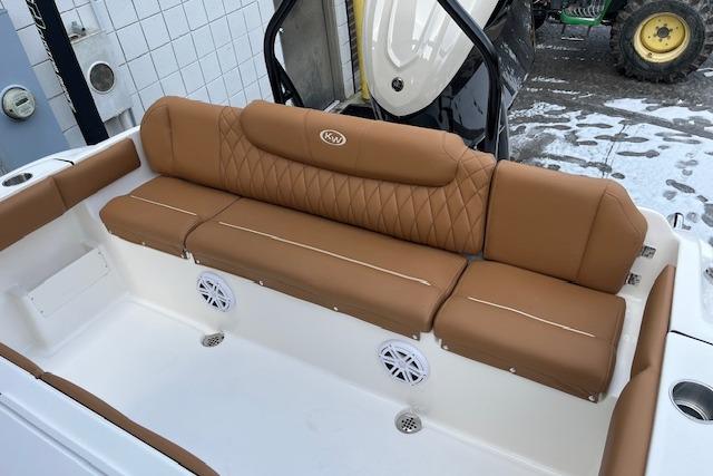 2026 Key West 239 FSR boat with tan cushioned seating and integrated speakers.