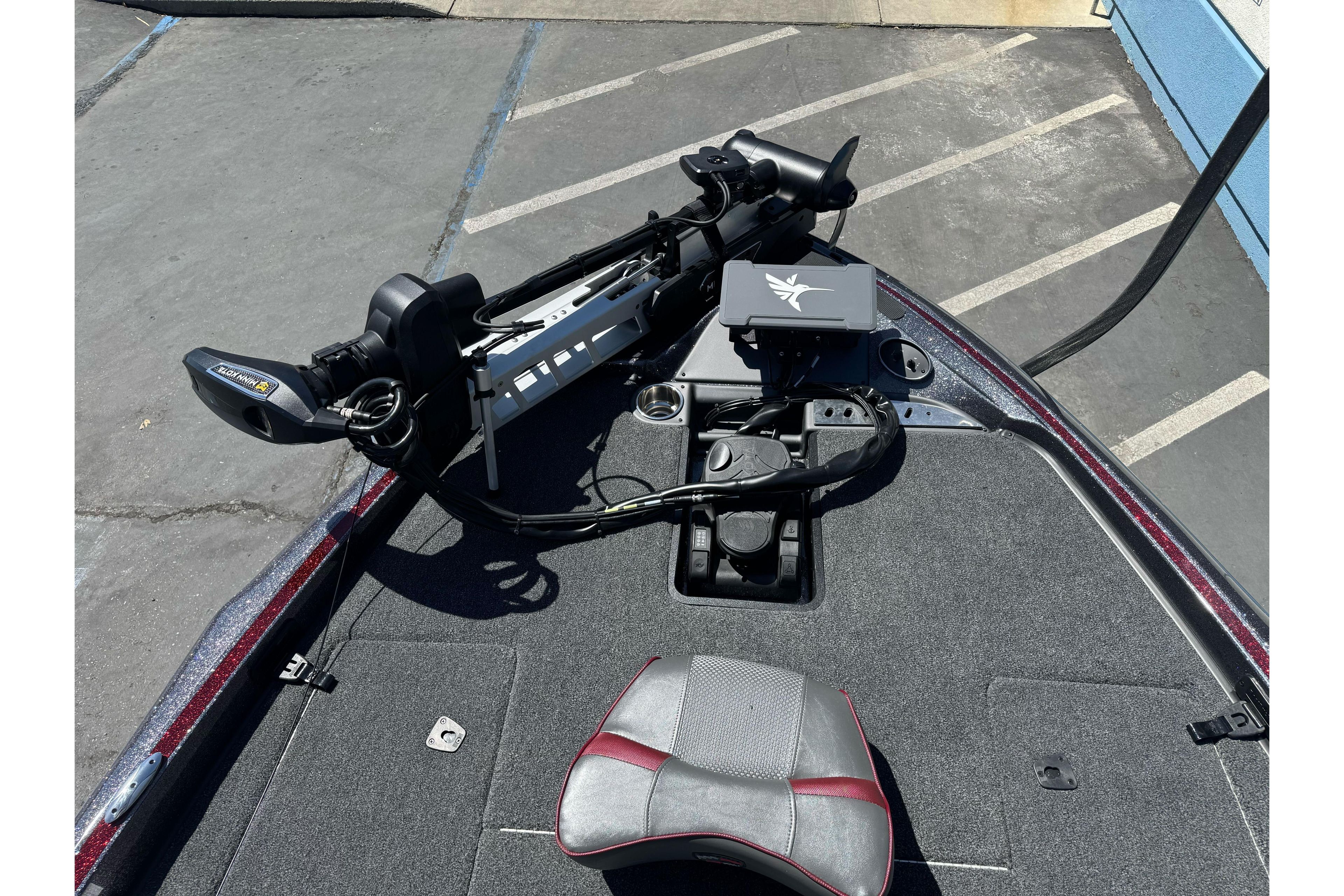 2026 Triton 18 TrX boat deck with trolling motor and control panel.