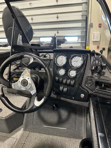 2023 Tracker Targa V-18 WT boat dashboard with steering wheel and gauges.